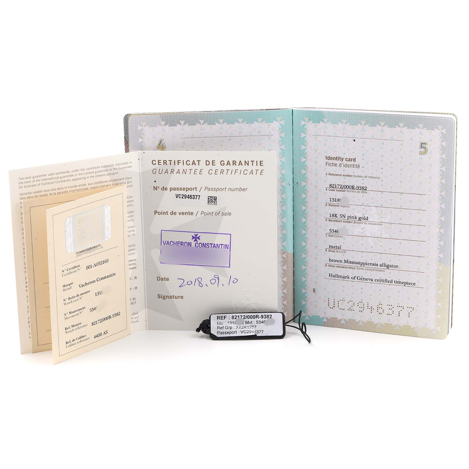 The image shows Vacheron Constantin Traditionnelle 82172/000R-9382 Men's Rose Gold Silver Dial model warranty documents and a tag, displayed at a slight angle.