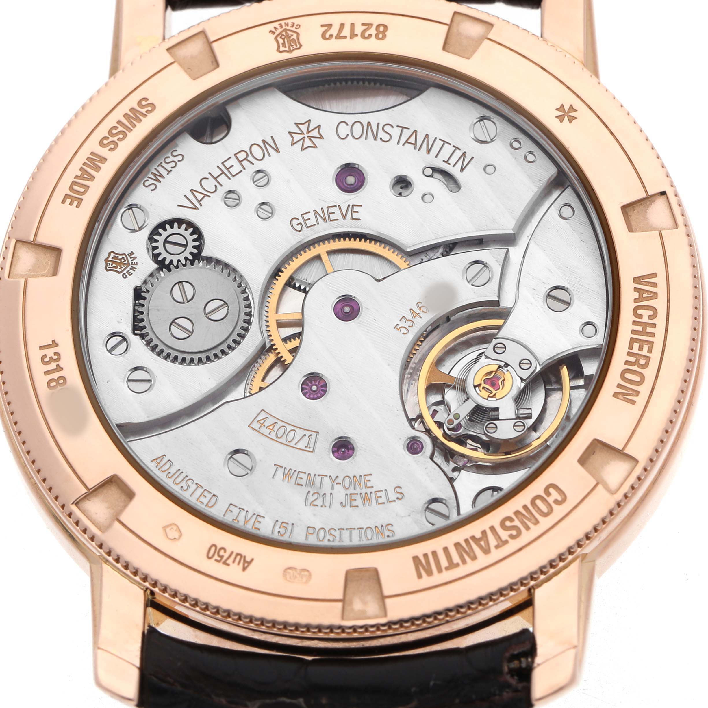 The image shows the back view of a Vacheron Constantin Traditionnelle 82172/000R-9382 Men's Rose Gold Silver Dial watch, highlighting its mechanical movement and intricate details.