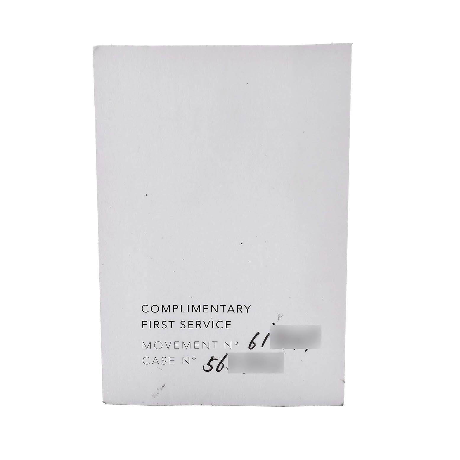 The image shows a Zenith Defy 49.9007.9004 Men's Ceramic Black Dial's complimentary first service card with serial numbers.