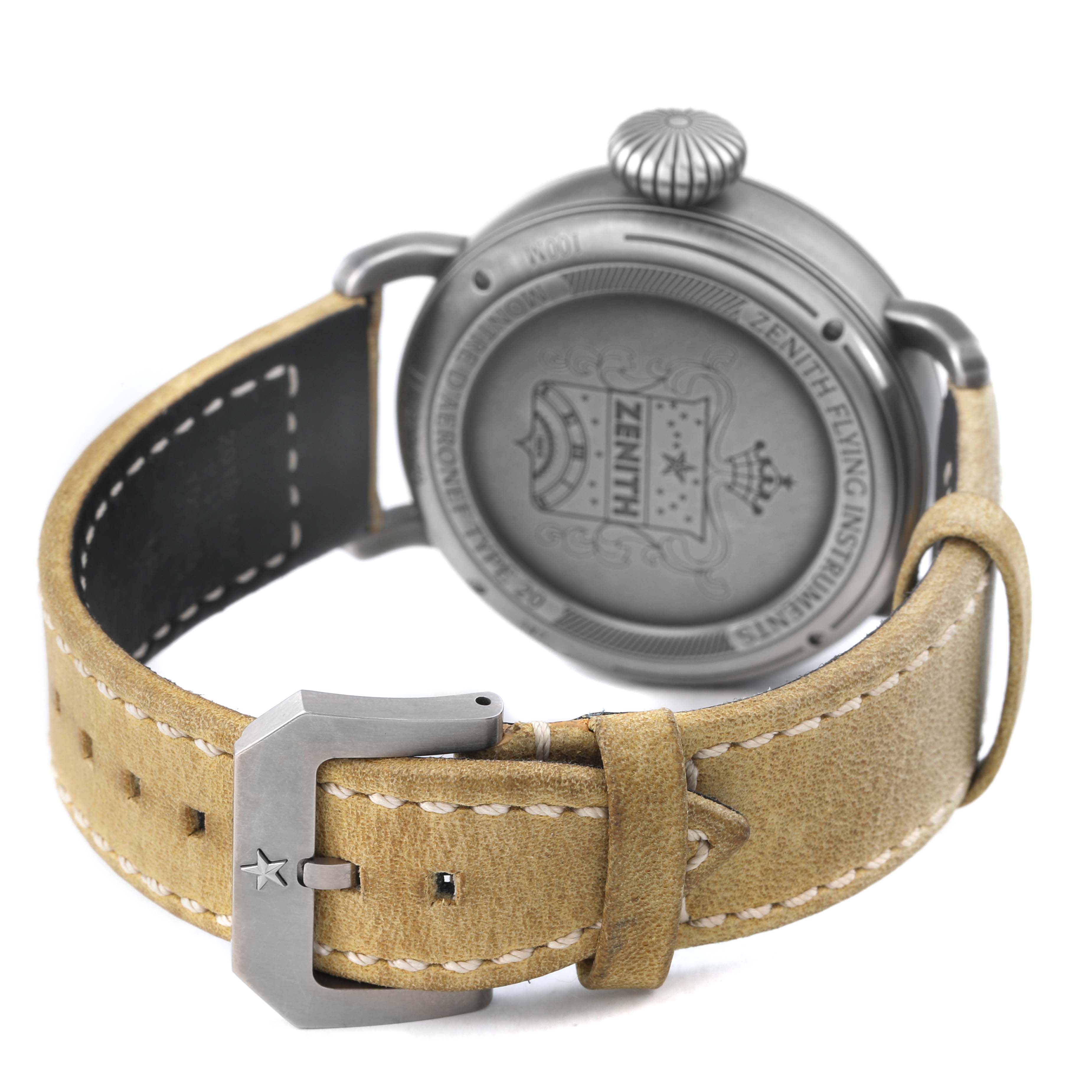 The image shows the back case and strap of a Zenith Pilot 11.1940.679 Men's Stainless Steel Grey Dial watch, highlighting the engraved details and leather buckle.