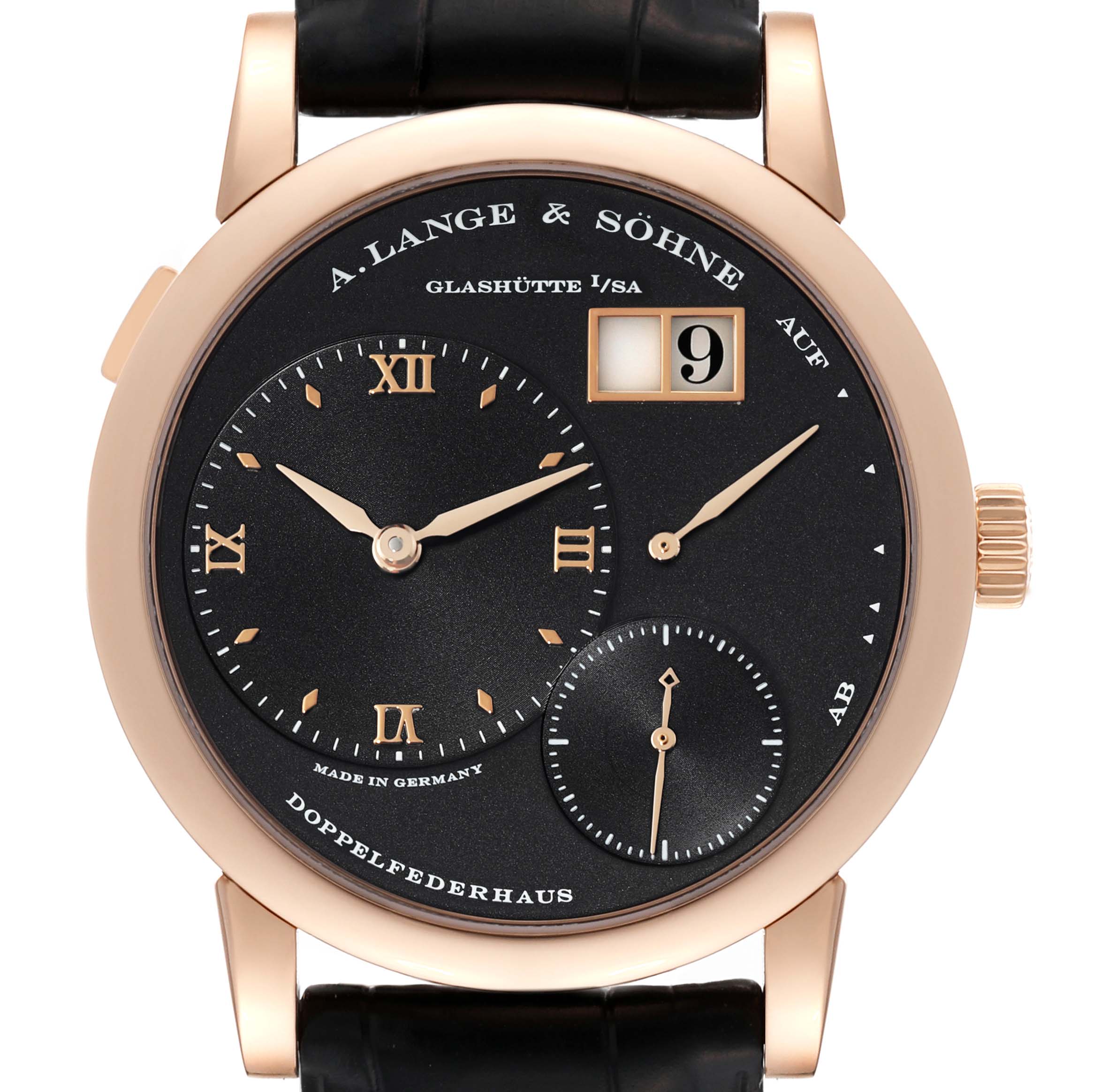 The image shows a front view of the A. Lange & Sohne Lange 1 101.031 Men's Rose Gold Black Dial watch featuring its dial, hands, date display, and crown.