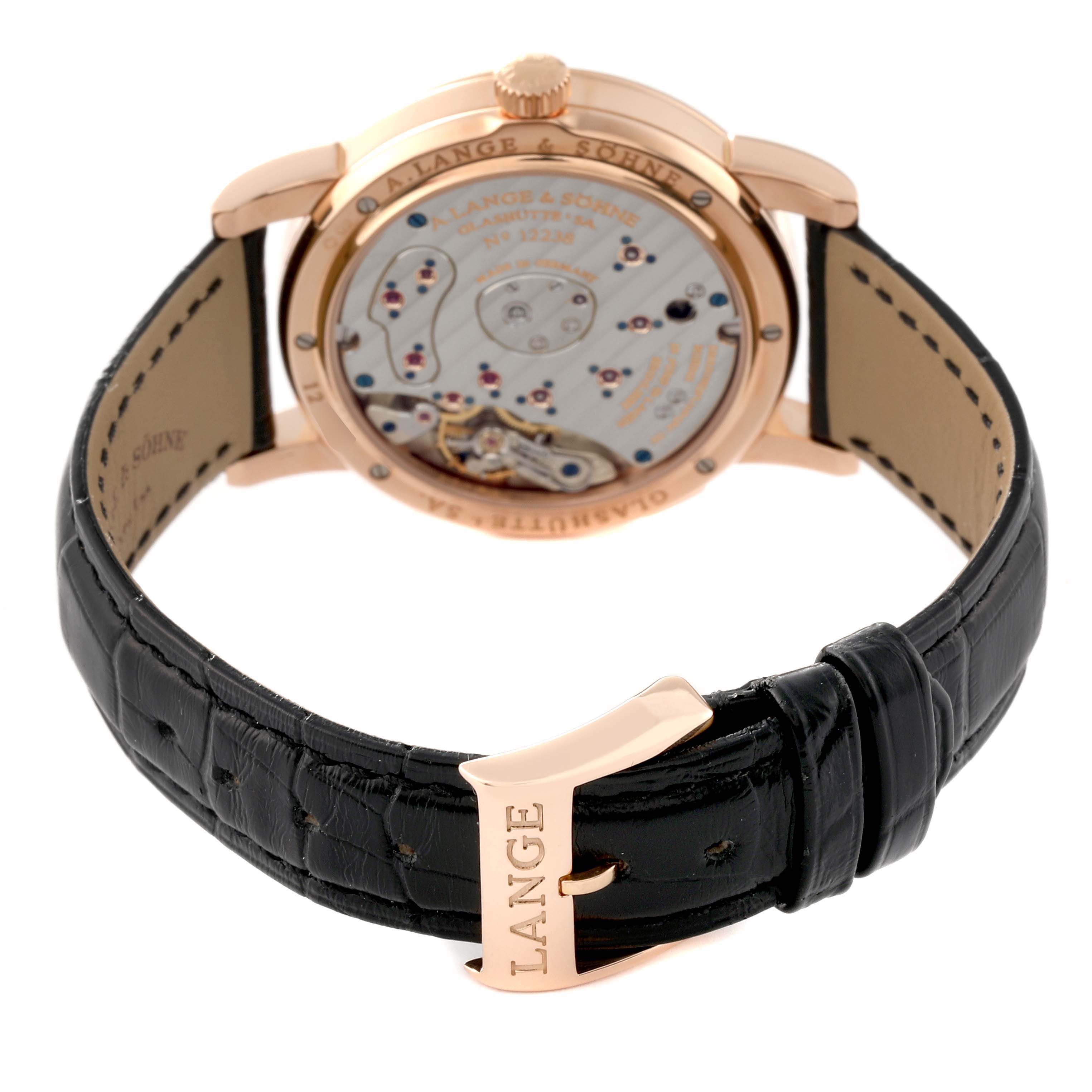 This image shows the back view of the A. Lange & Sohne Lange 1 101.031 Men's Rose Gold Black Dial watch, highlighting its movement and black leather strap.
