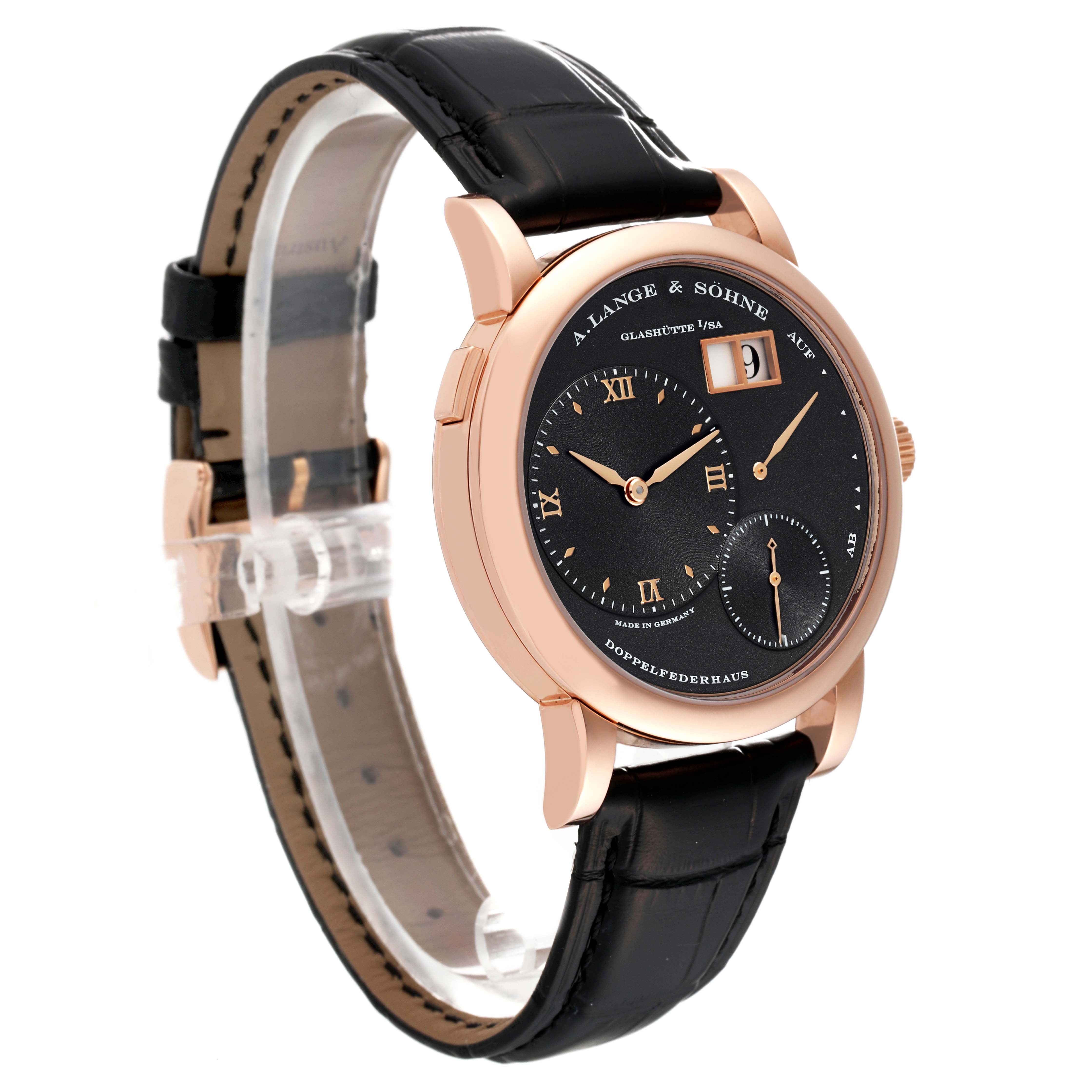 The image shows a side-angle view of the A. Lange & Sohne Lange 1 101.031 Men's Rose Gold Black Dial watch, featuring its dial, case, crown, and leather strap.