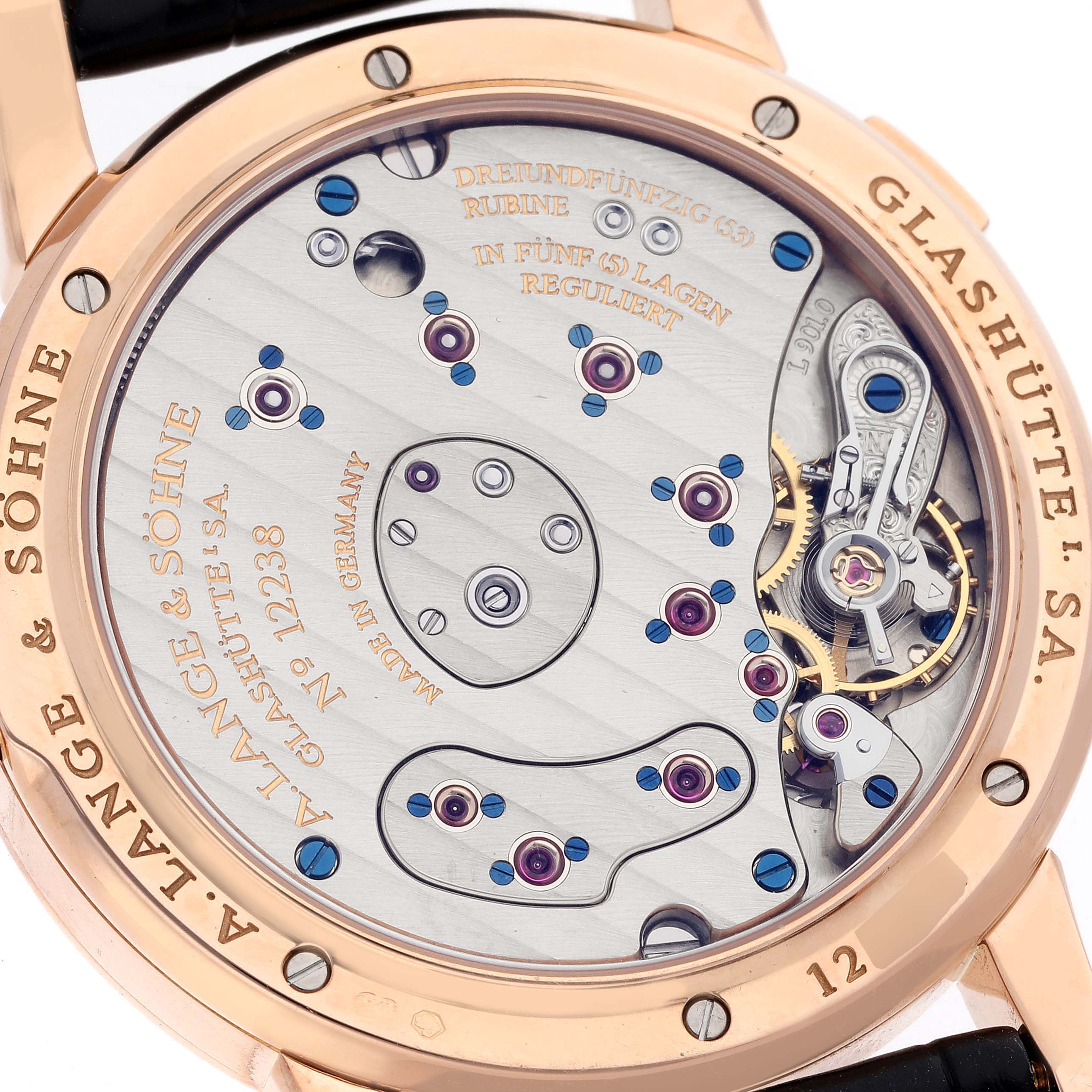 The image shows the back view of the A. Lange & Sohne Lange 1 101.031 Men's Rose Gold Black Dial watch, highlighting its intricate movement and engravings.