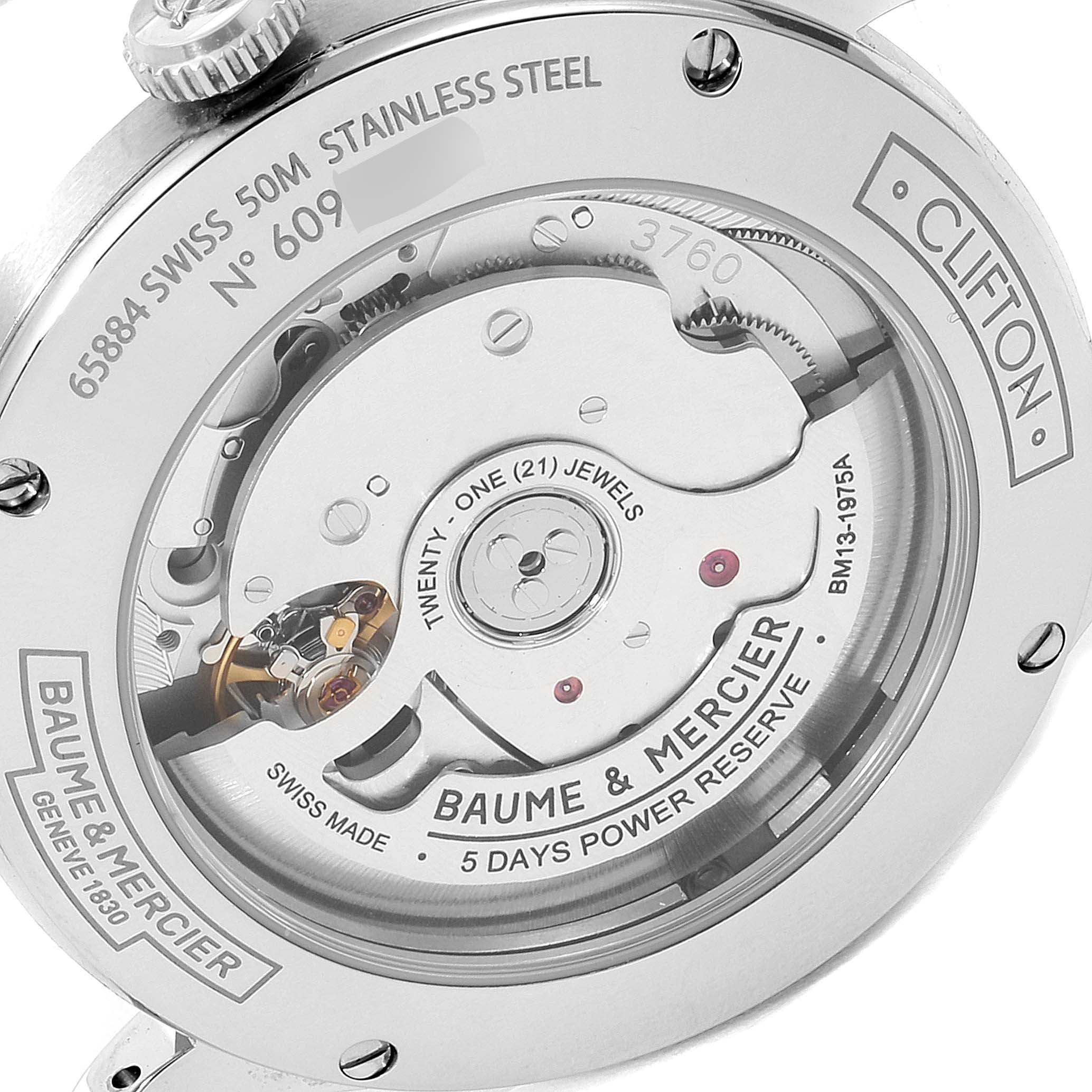 This image shows the back of a Baume & Mercier Clifton M0A10467 Men's Stainless Steel Blue Dial M0A10467 Men's Stainless Steel Blue Dial watch, highlighting its internal mechanisms and engraving details.