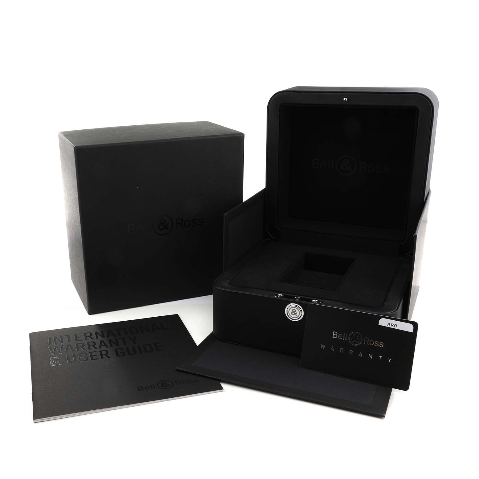 The image shows the packaging and accessories for the Bell & Ross Urban BR05G-BL-ST/SRB Men's Stainless Steel Black Dial model, including the box, warranty card, and user guide.