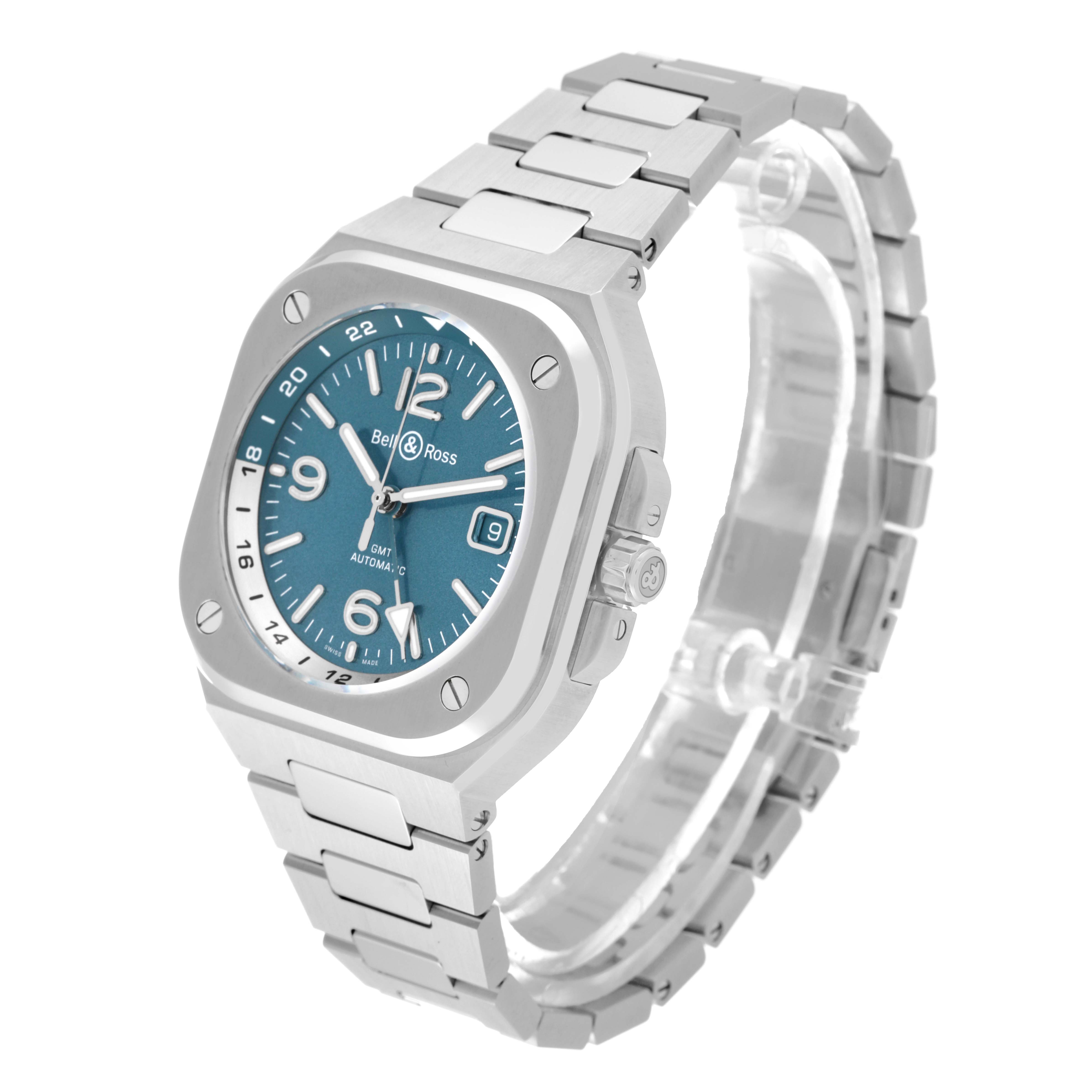 This image shows a Bell 
Ross Chronograph watch at an oblique angle, highlighting its blue dial, metal case, and bracelet.