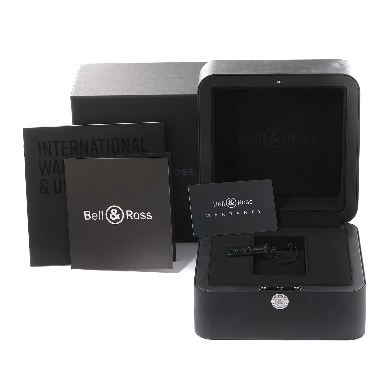 This image shows the Bell 
Ross Chronograph watch box, warranty card, and documentation from a front angle.