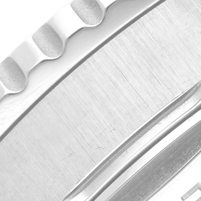 This image shows a close-up of the bezel and brushed metal case of a Breitling Navitimer AB0138241C1A1 Men
s Stainless Steel Blue Dial AB0138241C1A1 Men
s Stainless Steel Blue Dial watch.