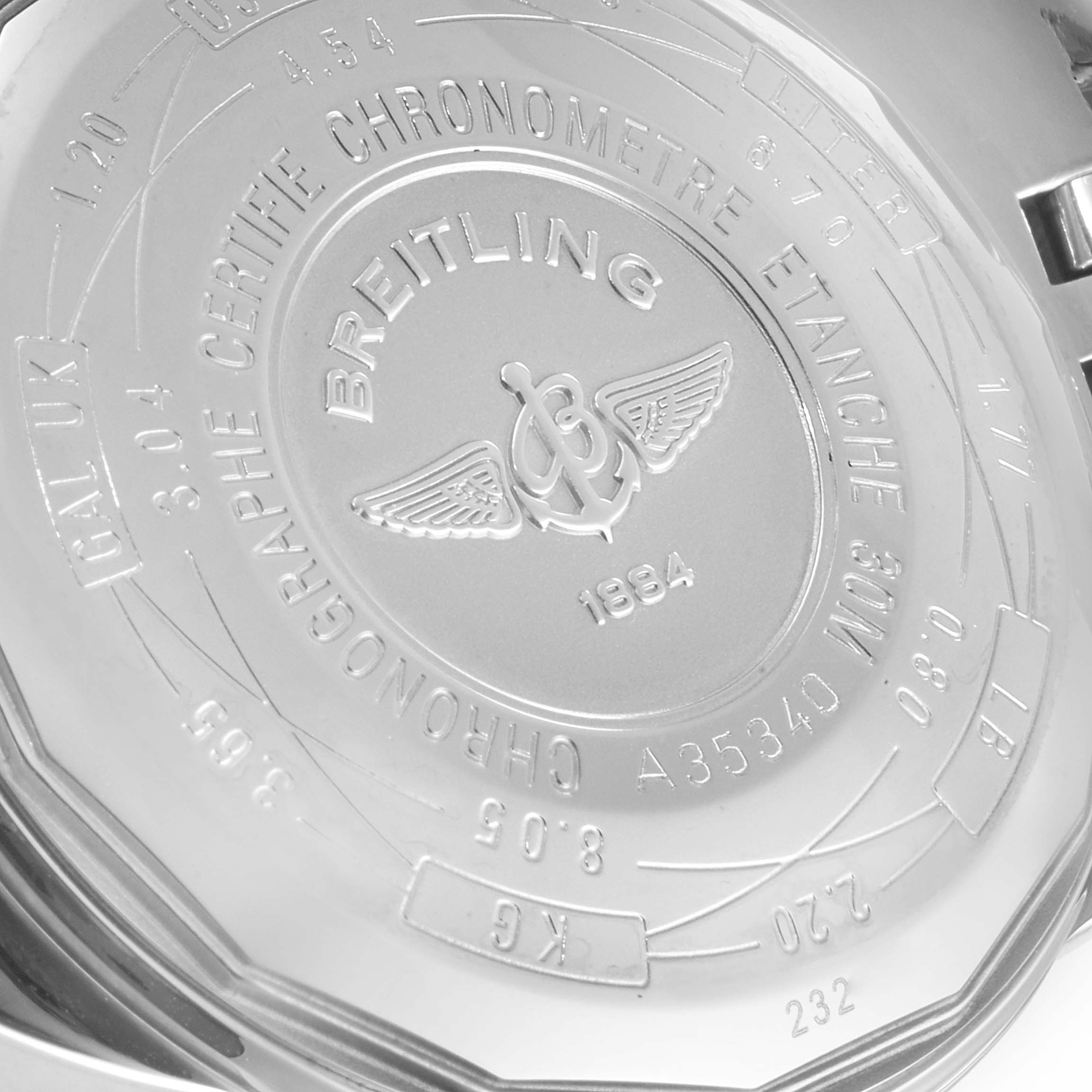 The image shows the back case of a Breitling Navitimer A35340 Men
s Stainless Steel Grey Dial A35340 Men
s Stainless Steel Grey Dial watch with engraved details and branding.