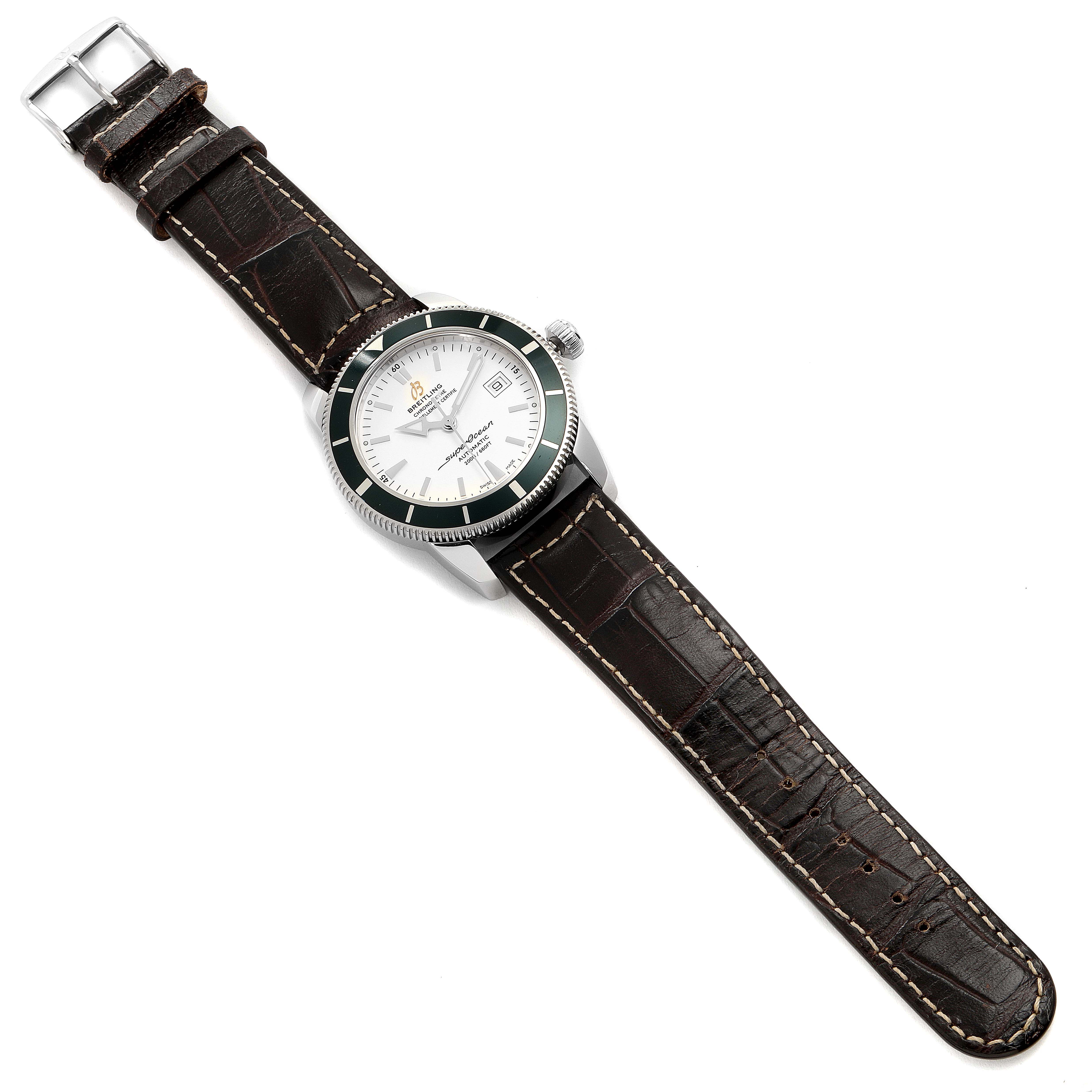 This image shows a Breitling Superocean A17321 Men
s Stainless Steel White Dial A17321 Men
s Stainless Steel White Dial watch from a top-down angle, highlighting its face, bezel, crown, and leather strap.