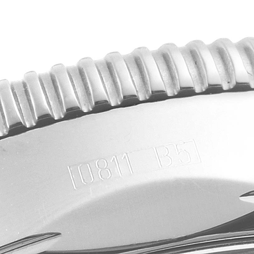 This close-up image shows the side of the bezel and part of the case of a Breitling Superocean A17321 Men
s Stainless Steel White Dial A17321 Men
s Stainless Steel White Dial watch.