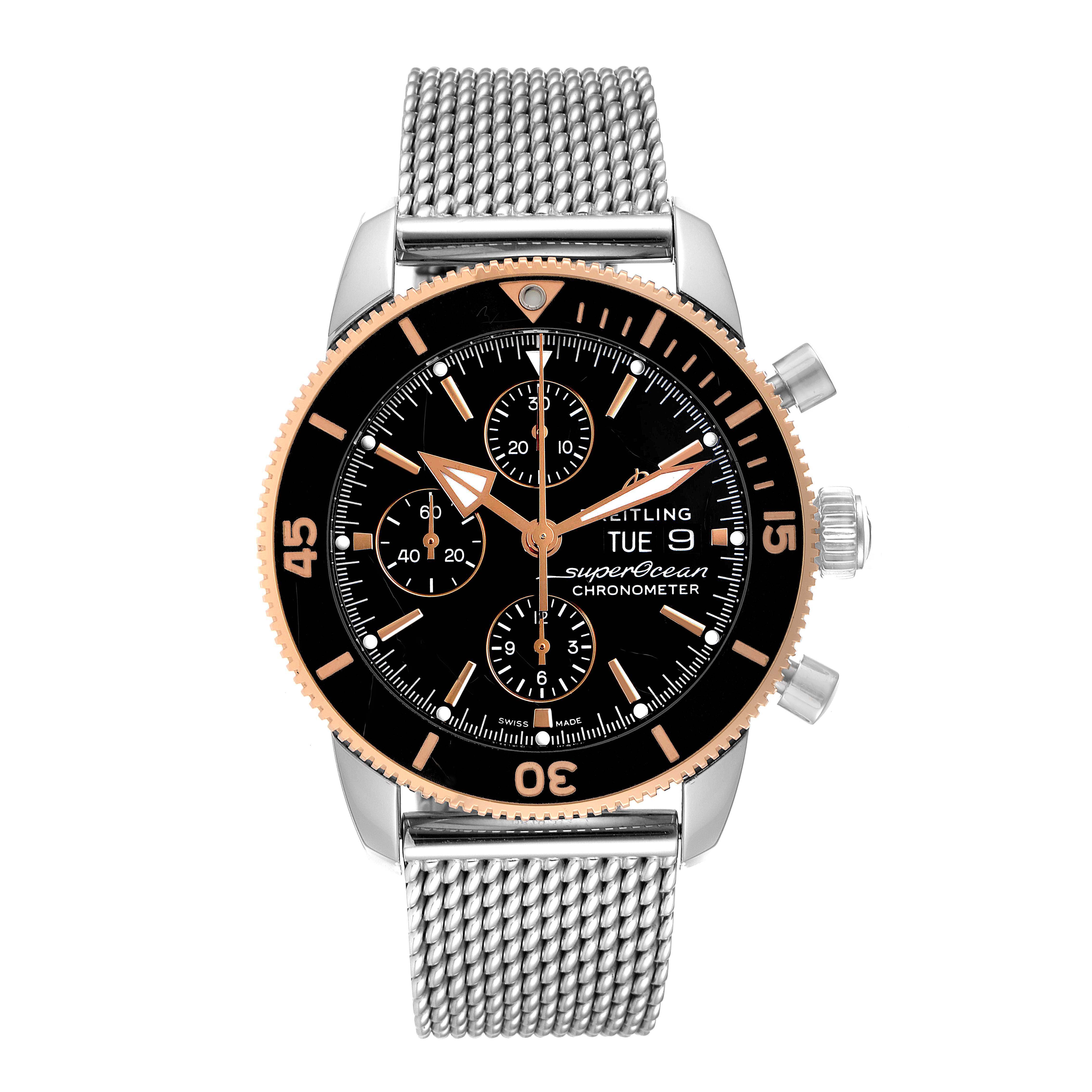 This is a front view of a Breitling Superocean U13313121B1A1 Men's Steel and Gold (two tone) Black Dial U13313121B1A1 Men's Steel and Gold (two tone) Black Dial watch displaying its mesh strap, bezel, chronograph subdials, and day-date function.