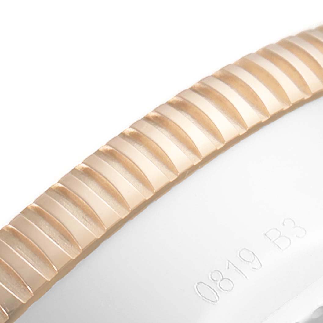 The image shows a close-up of the bezel and part of the case of a Breitling Superocean U13313121B1A1 Men's Steel and Gold (two tone) Black Dial U13313121B1A1 Men's Steel and Gold (two tone) Black Dial watch.