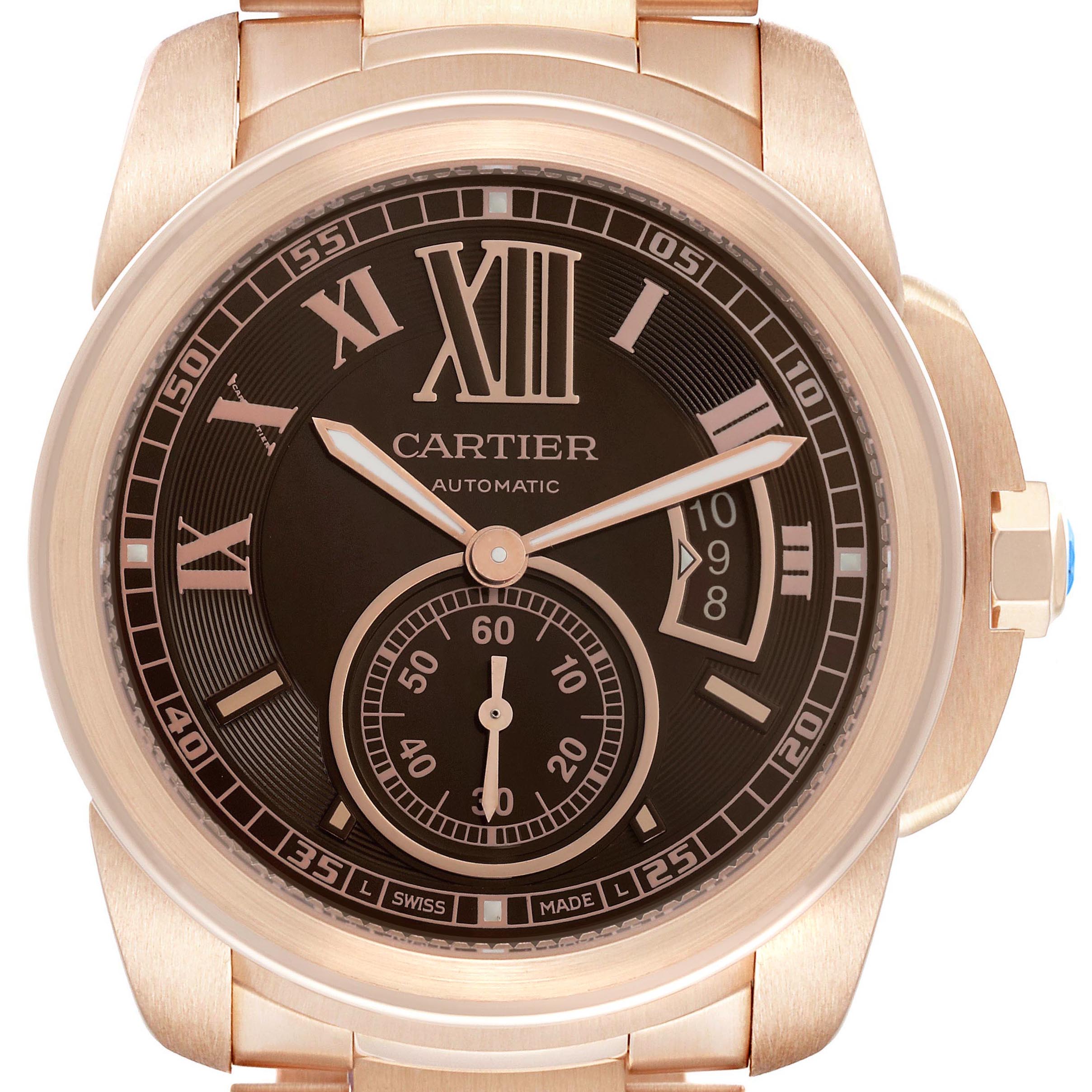 The image shows a front view of the Calibre de Cartier watch, displaying its face, hands, crown, and partial bracelet.