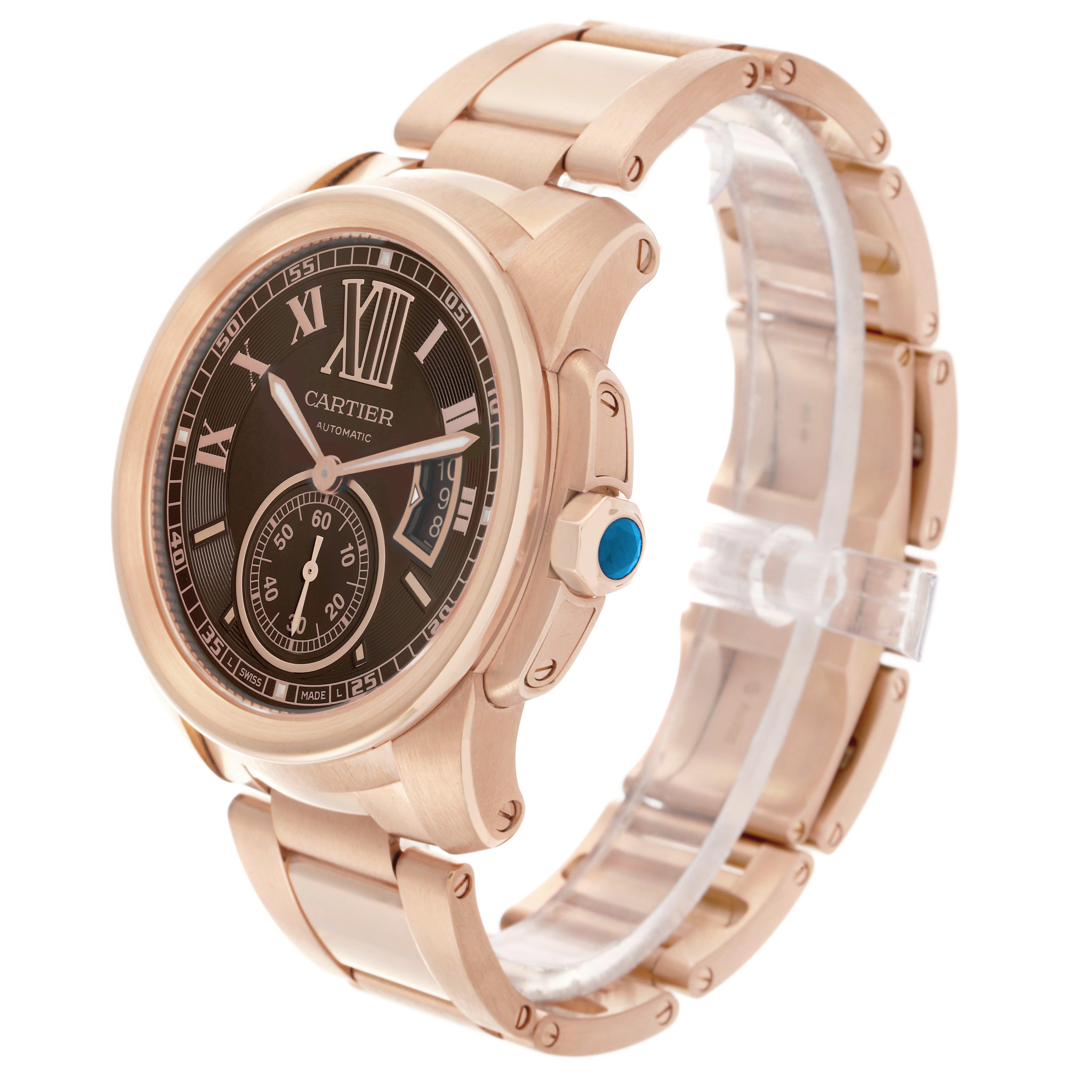 The Calibre de Cartier watch is shown at a three-quarter angle, highlighting the face, crown, and bracelet.