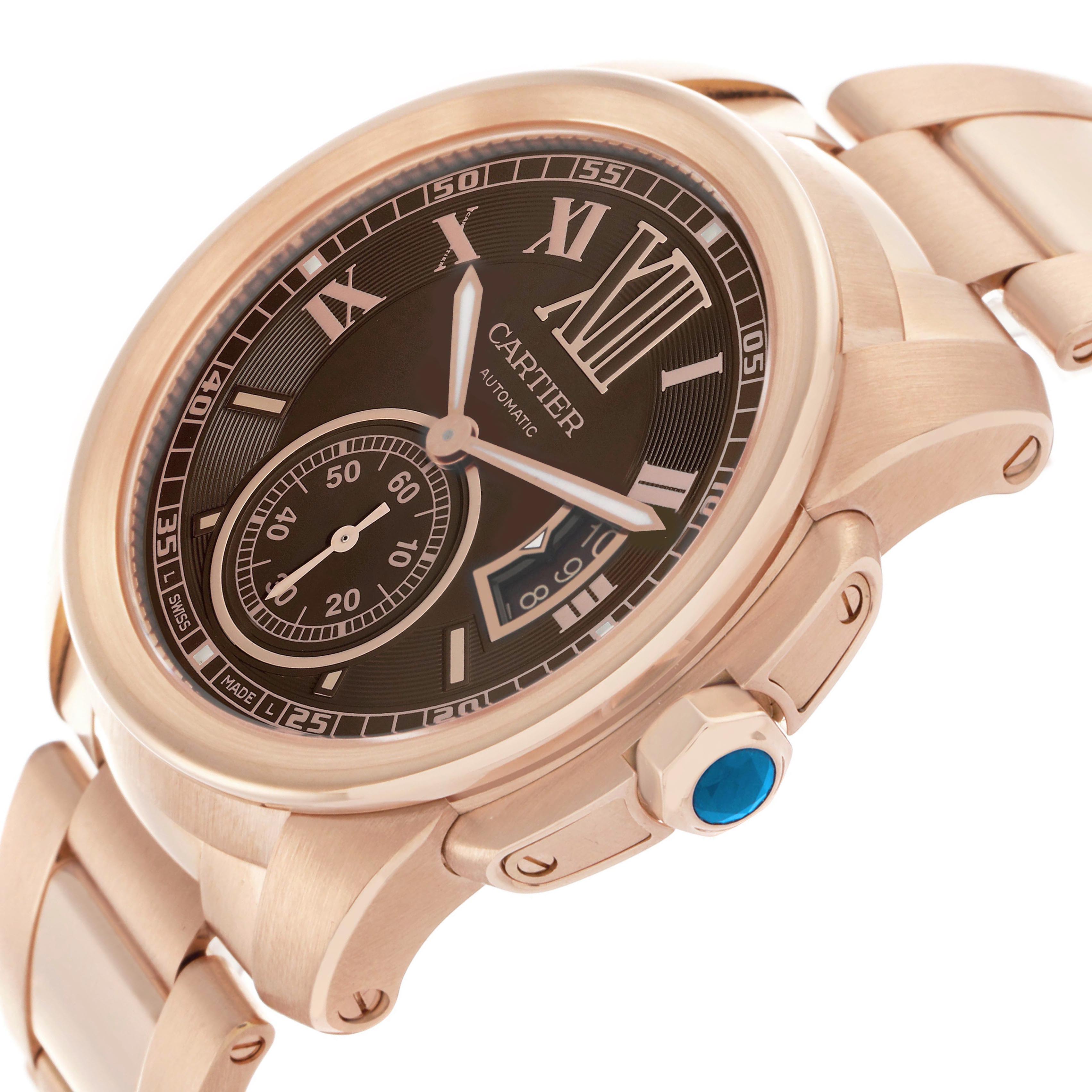 The Calibre de Cartier watch is shown at an angled side view, highlighting its face, crown with blue cabochon, and bracelet.