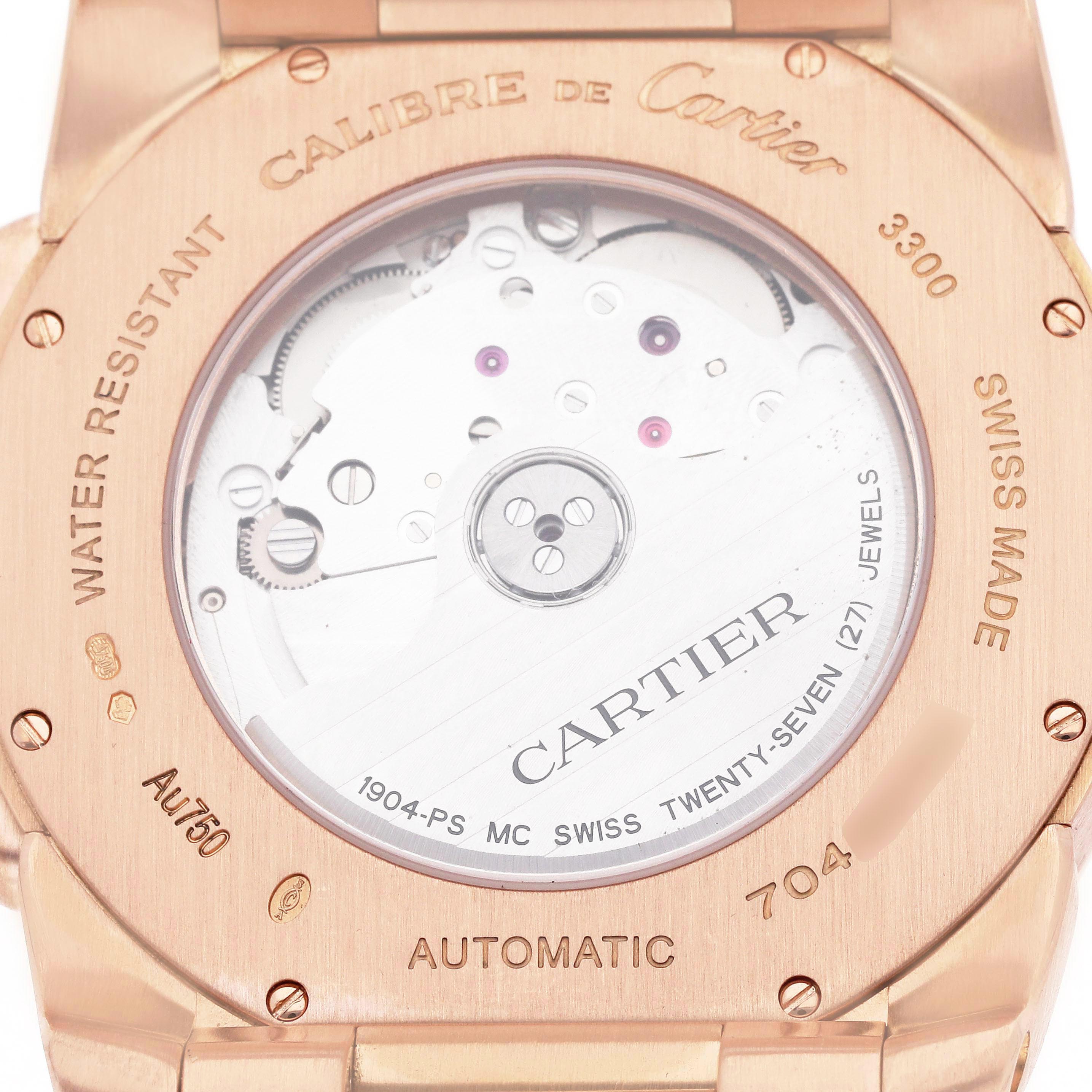 The image shows the back of a Calibre de Cartier watch, highlighting its automatic movement and engravings.