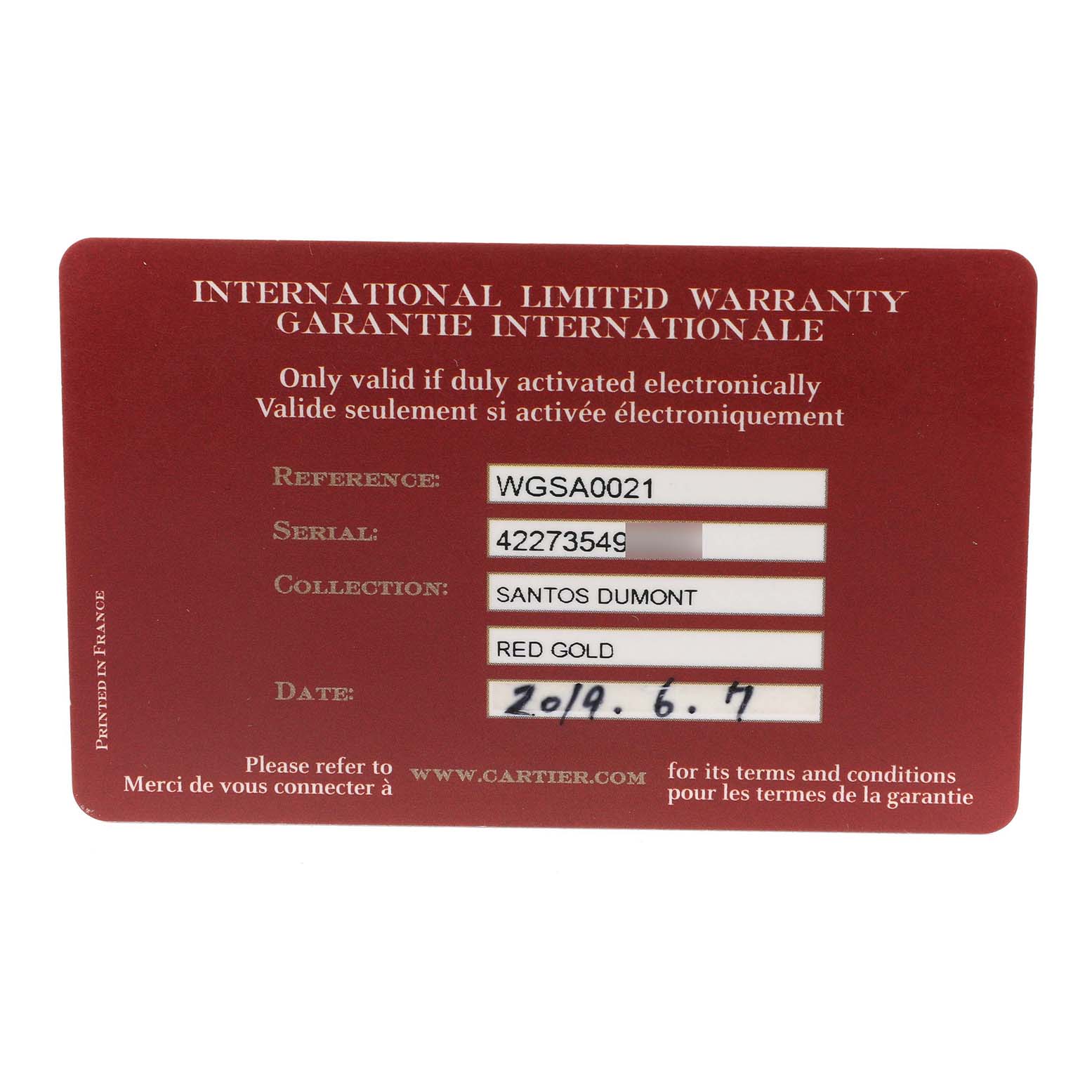 The image shows the warranty card for the Cartier Santos Dumont WGSA0021 Men's Rose Gold Silver Dial watch, displaying reference, serial, collection, and date details.