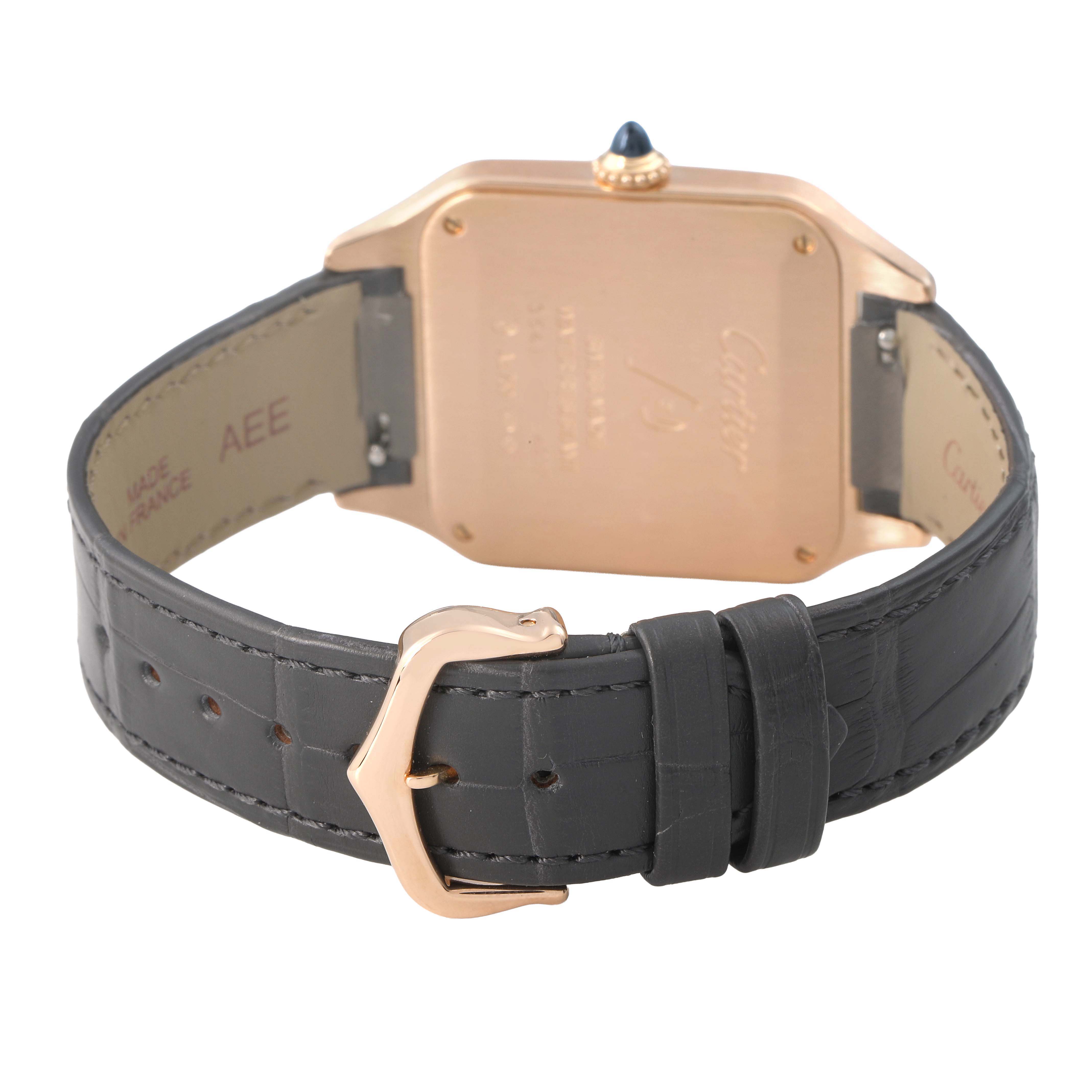 The image shows the back and strap of a Cartier Santos Dumont WGSA0021 Men's Rose Gold Silver Dial watch, highlighting the clasp and case back details.