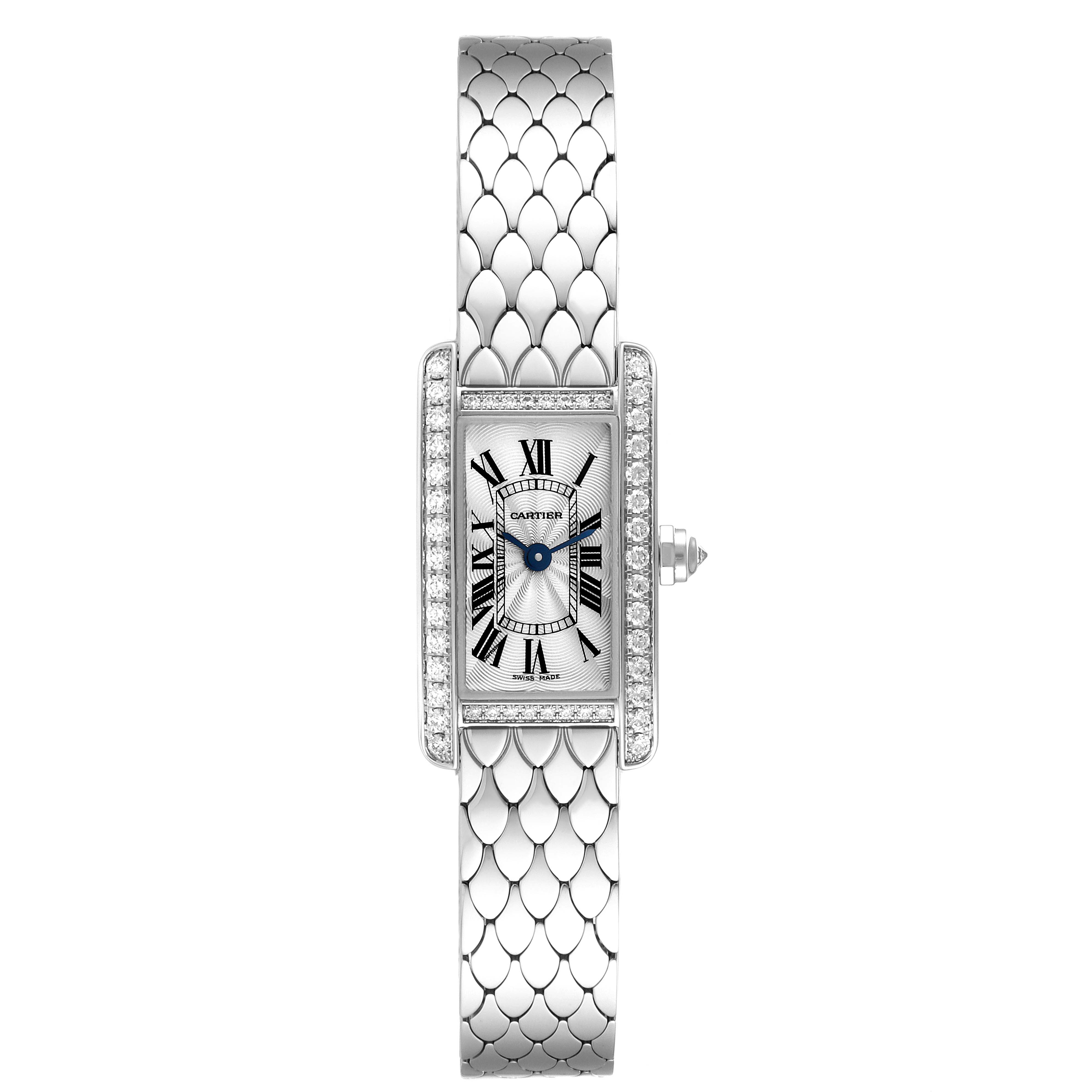 The image shows a top-down view of a Cartier Tank Americaine WB710013 Women's White Gold Silver Dial WB710013 Women's White Gold Silver Dial watch, highlighting the rectangular dial, blue hands, and decorative bracelet.