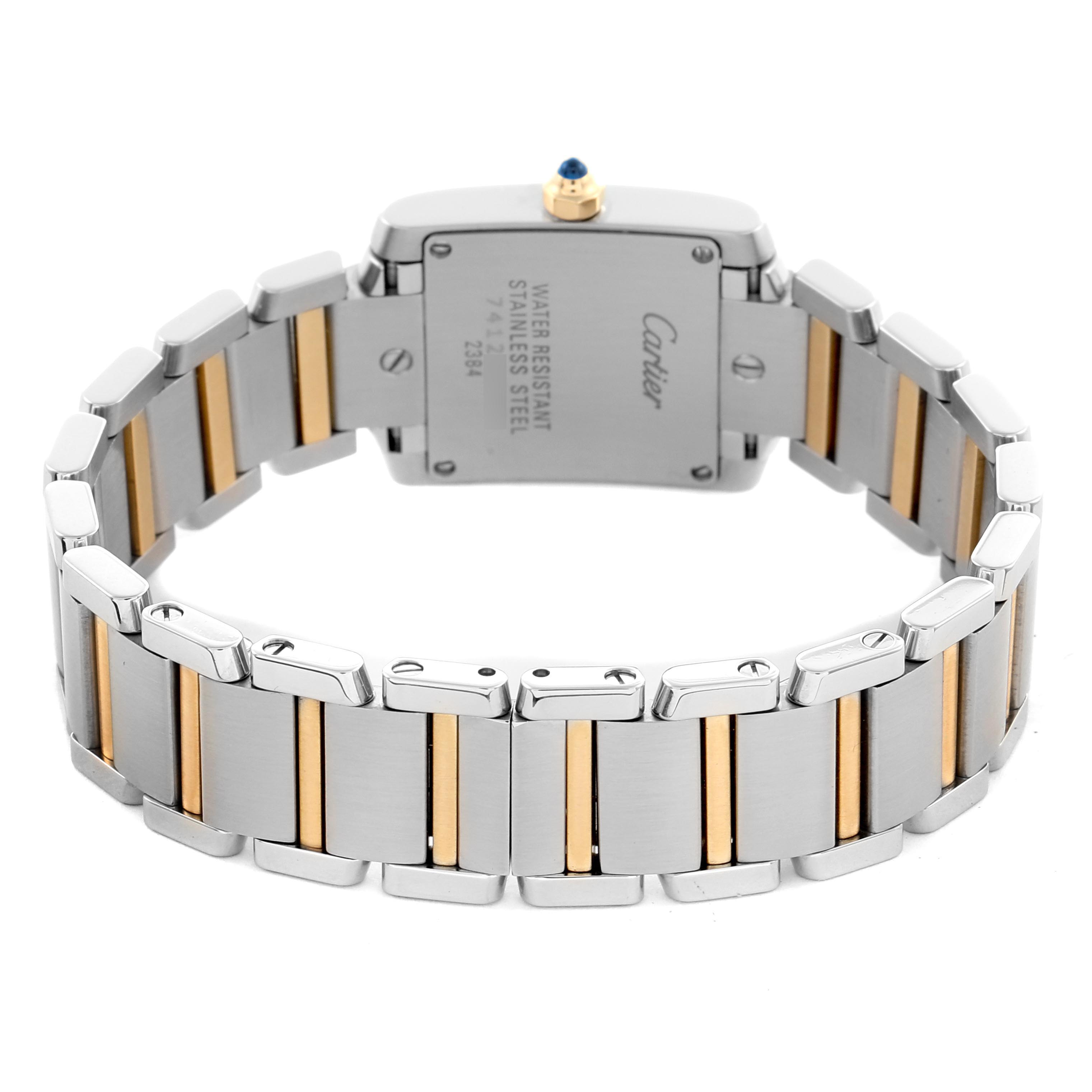 The image shows the back of a Cartier Tank Francaise W51007Q4 Women's Steel and Gold (two tone) Silver Dial W51007Q4 Women's Steel and Gold (two tone) Silver Dial watch, highlighting its two-tone bracelet and case back.
