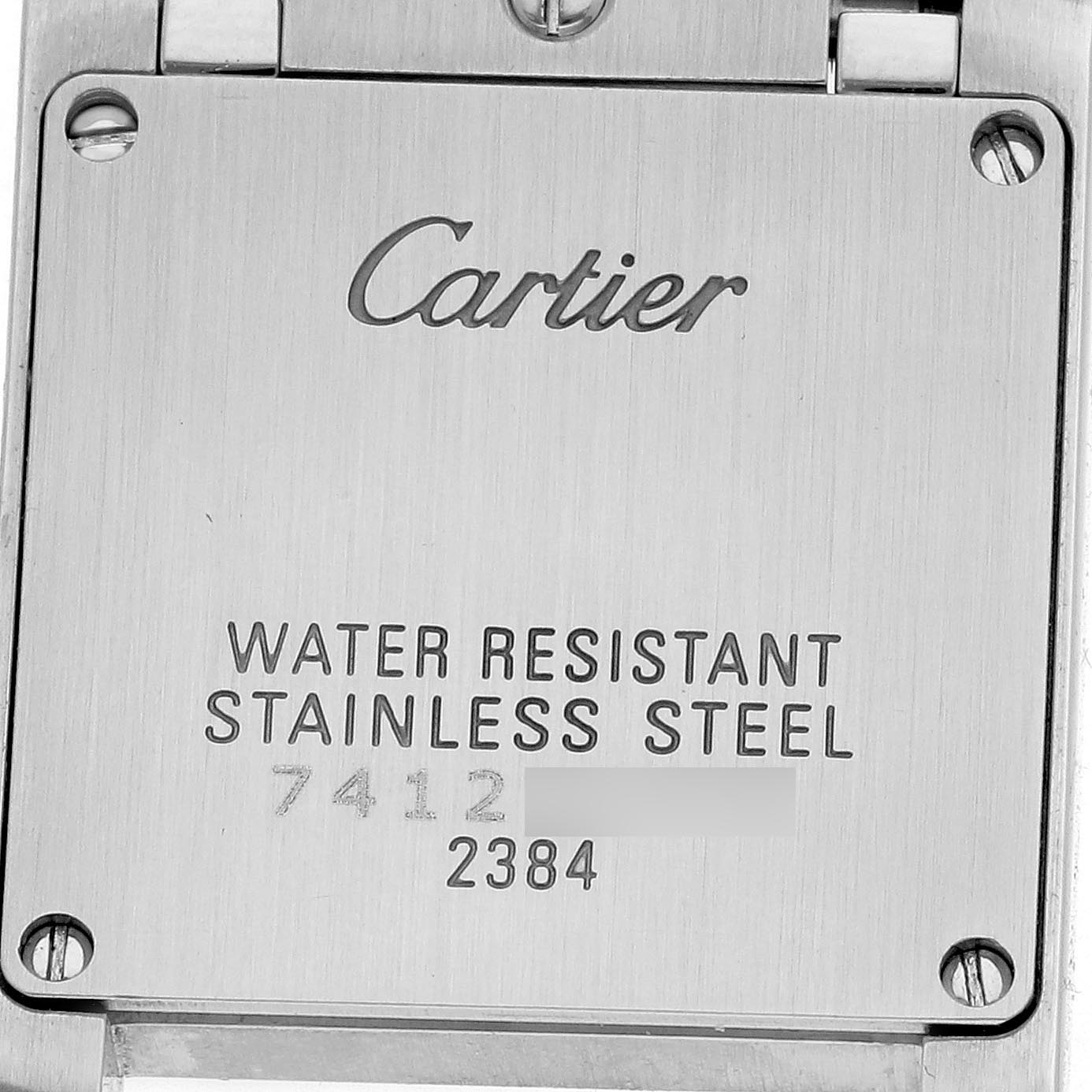 The image shows the back casing of a Cartier Tank Française watch, highlighting the brand, water resistance, and stainless steel material.