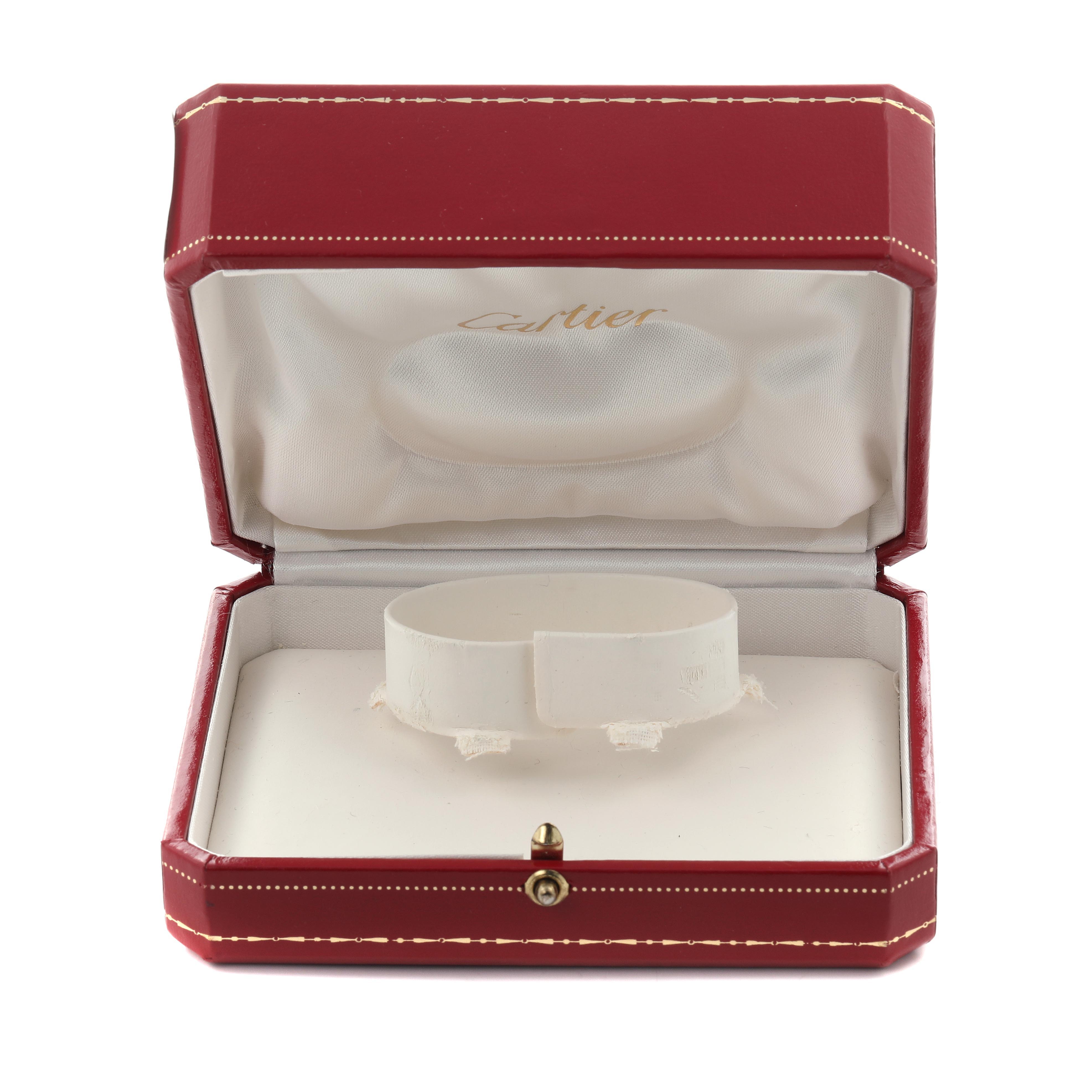 The image shows a Cartier Tank Francaise W50002N2 Women's Yellow Gold Silver Dial W50002N2 Women's Yellow Gold Silver Dial watch box open, displaying its cushioned interior for watch placement.