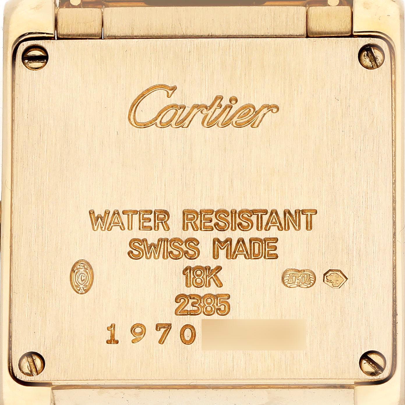 The image shows the back of a Cartier Tank Francaise W50002N2 Women's Yellow Gold Silver Dial W50002N2 Women's Yellow Gold Silver Dial watch, highlighting engravings and hallmark details.