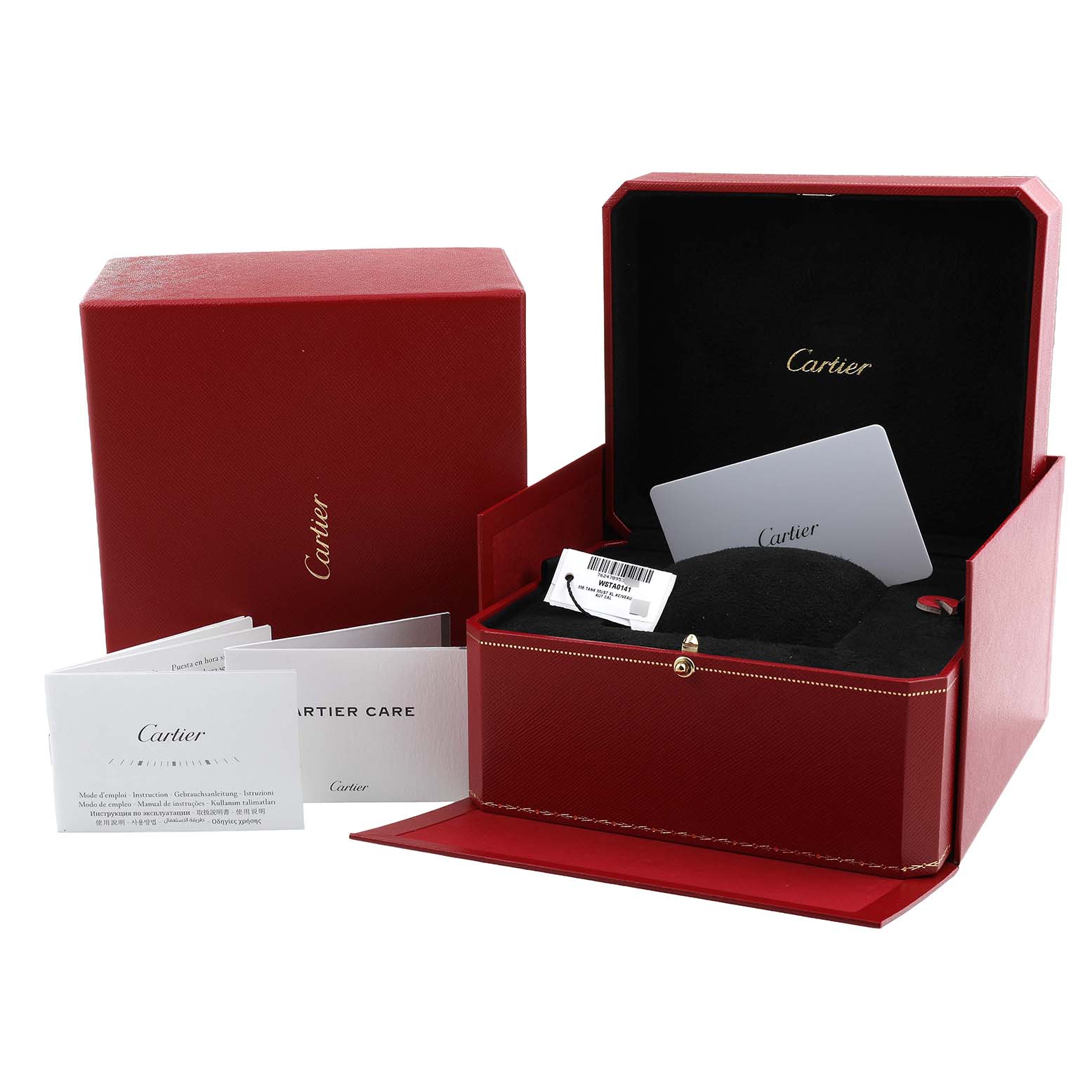 The image shows the Cartier Tank Must WSTA0141 Men's Stainless Steel Silver Dial model box with care booklets and a warranty card in an open display.