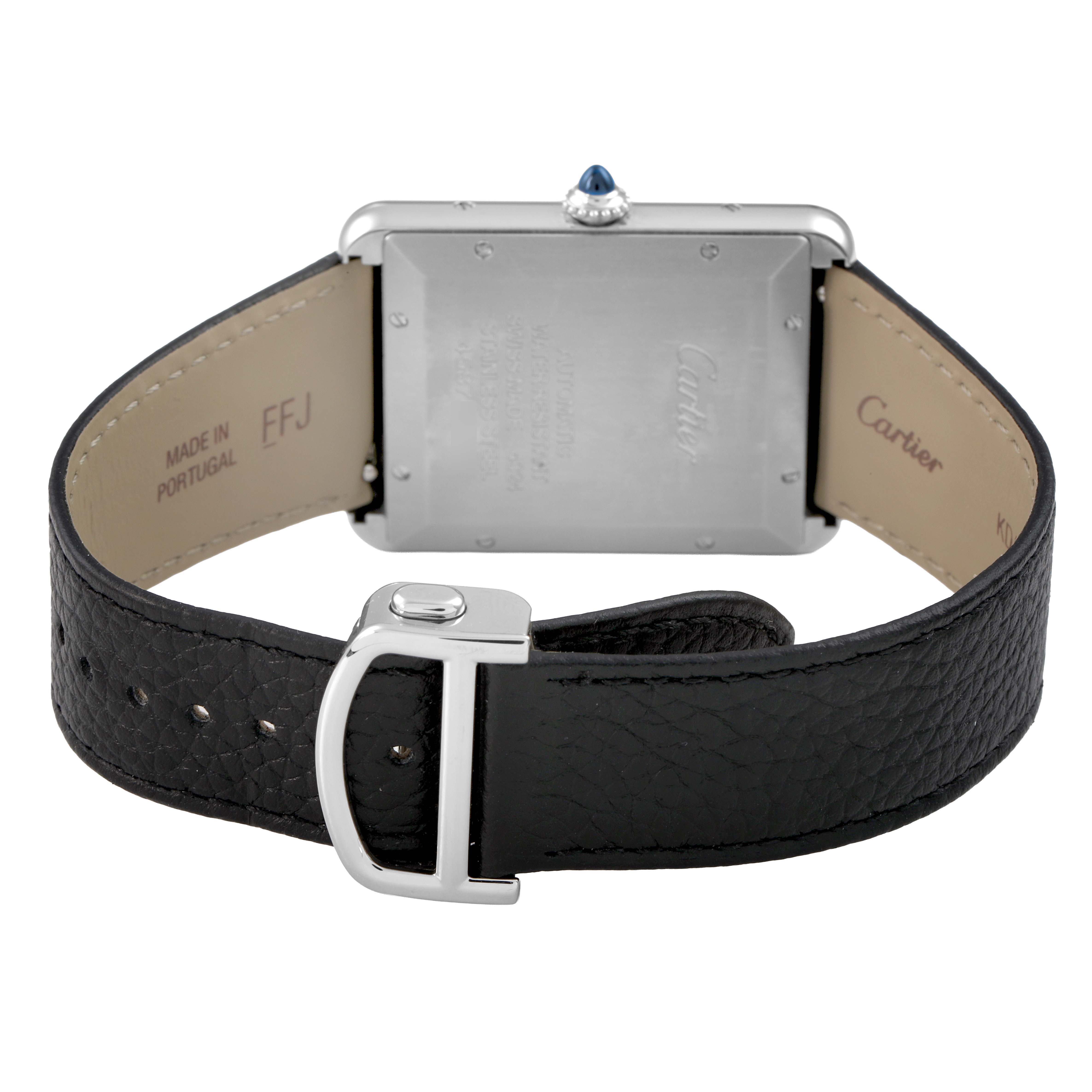 The image shows the back of a Cartier Tank Must WSTA0141 Men's Stainless Steel Silver Dial watch, highlighting the leather strap, clasp, and case back with engravings.