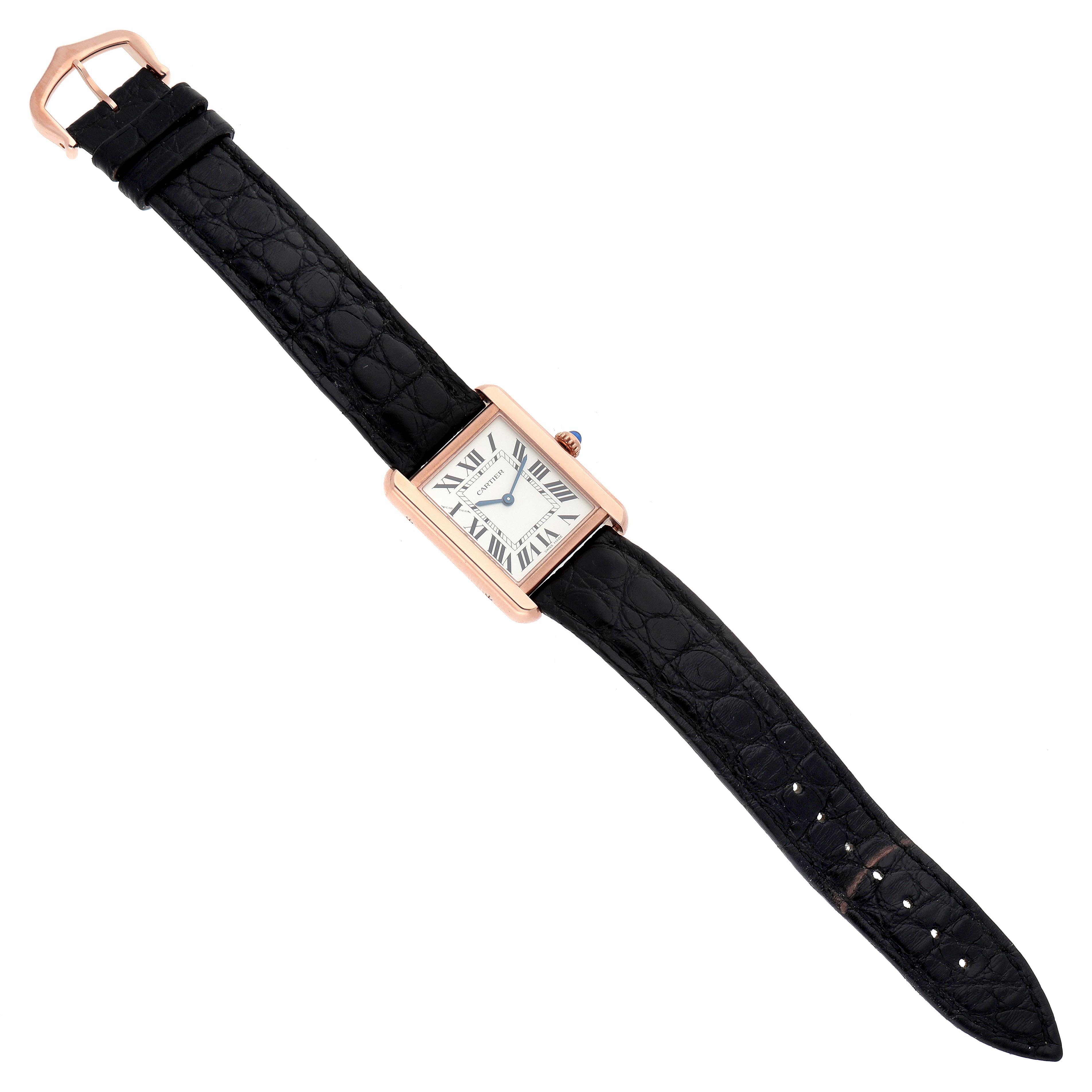 The Cartier Tank Solo W5200024 Women's Steel and Gold (two tone) Silver Dial W5200024 Women's Steel and Gold (two tone) Silver Dial watch is shown from a top view, highlighting its case, dial, and black leather strap.