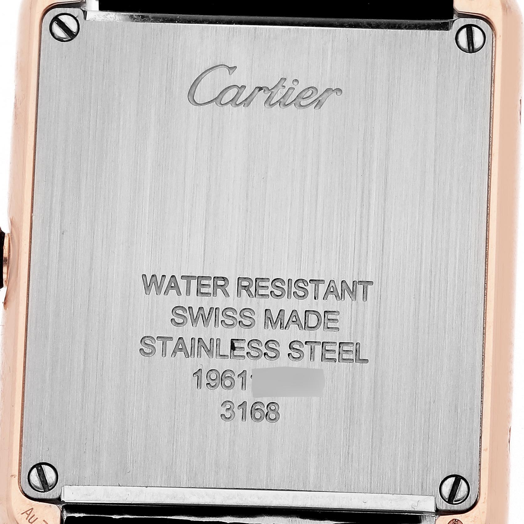 The image shows the backplate of a Cartier Tank Solo W5200024 Women's Steel and Gold (two tone) Silver Dial W5200024 Women's Steel and Gold (two tone) Silver Dial watch, highlighting brand engraving and specifications.