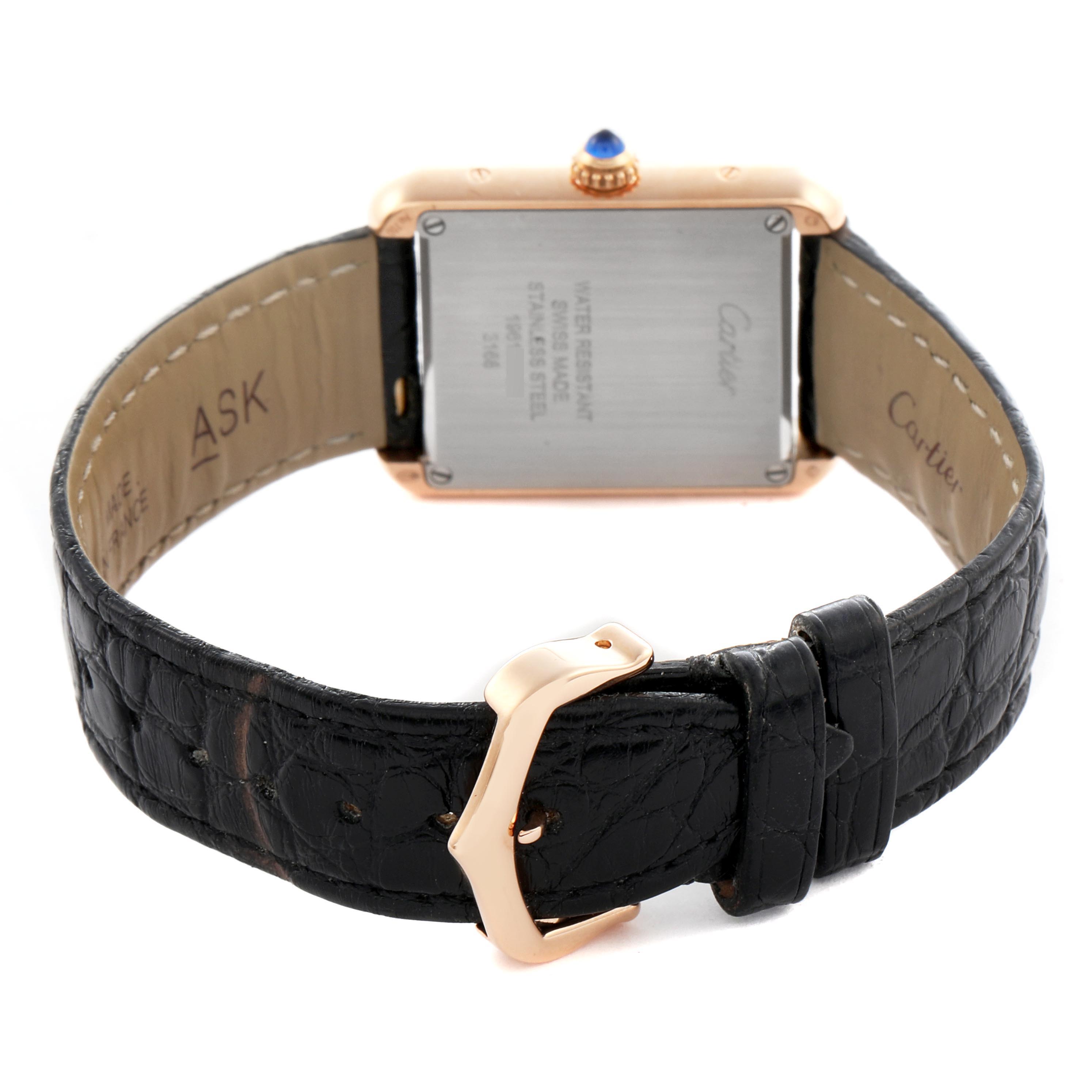 The image shows the back of a Cartier Tank Solo W5200024 Women's Steel and Gold (two tone) Silver Dial W5200024 Women's Steel and Gold (two tone) Silver Dial watch with its clasp and leather strap visible.