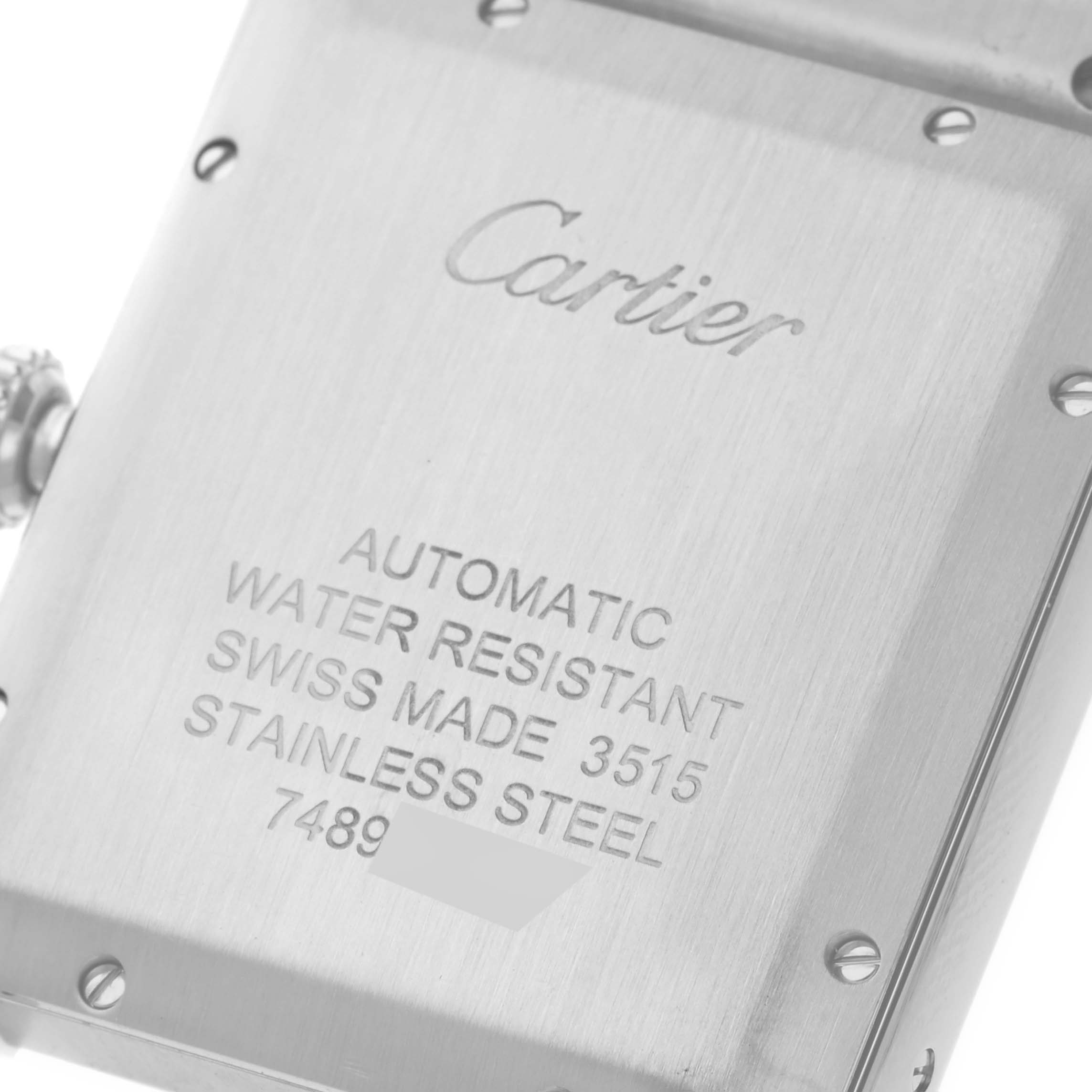 This image shows the back case of the Cartier Tank Solo W5200028 Men
s Stainless Steel Silver Dial W5200028 Men
s Stainless Steel Silver Dial watch, highlighting its engravings and screws.