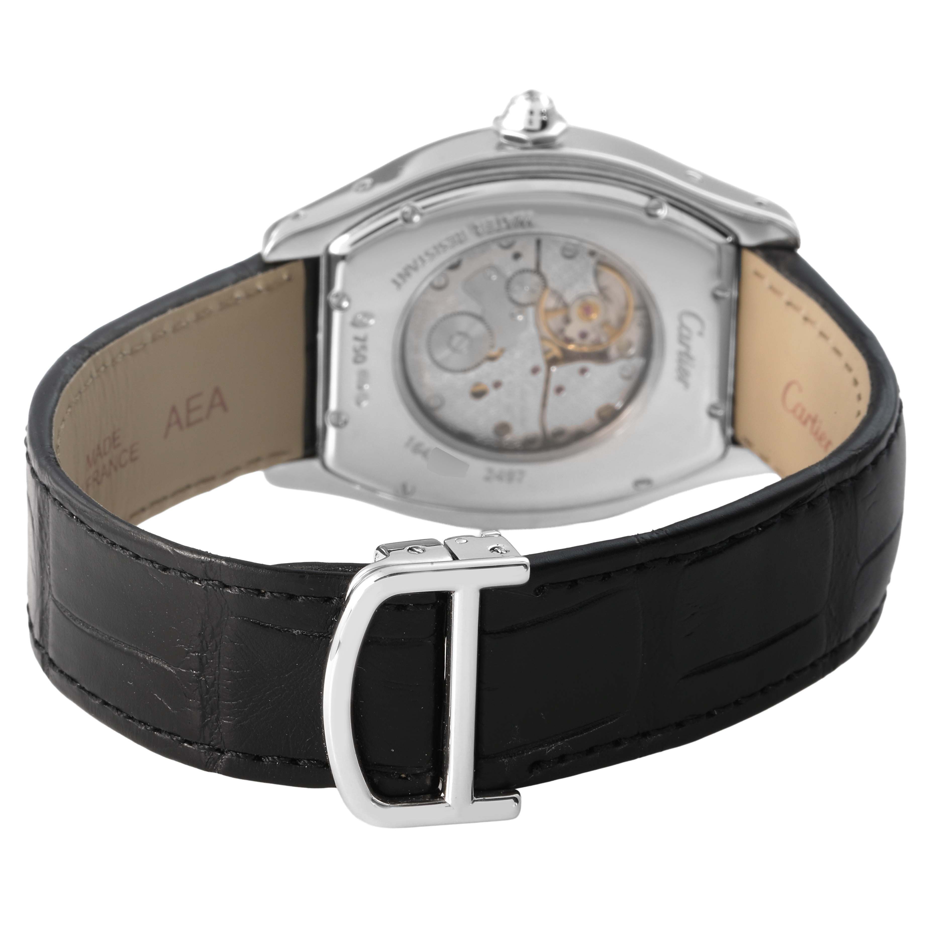 The Cartier Tortue WA503851 Men's White Gold Silver Dial watch is shown from the back, highlighting the movement and black leather strap with a metal buckle.