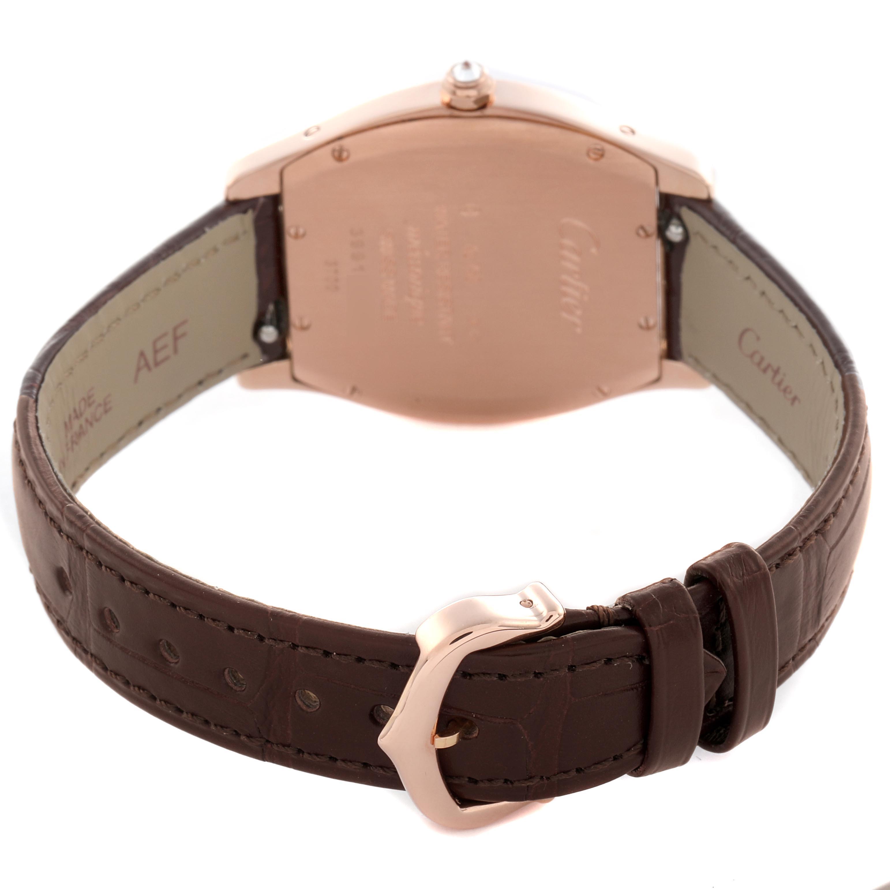 The Cartier Tortue WJTO0009 Women's Rose Gold Silver Dial WJTO0009 Women's Rose Gold Silver Dial watch is shown from the back, highlighting its case back, crown, and brown leather strap with a buckle.