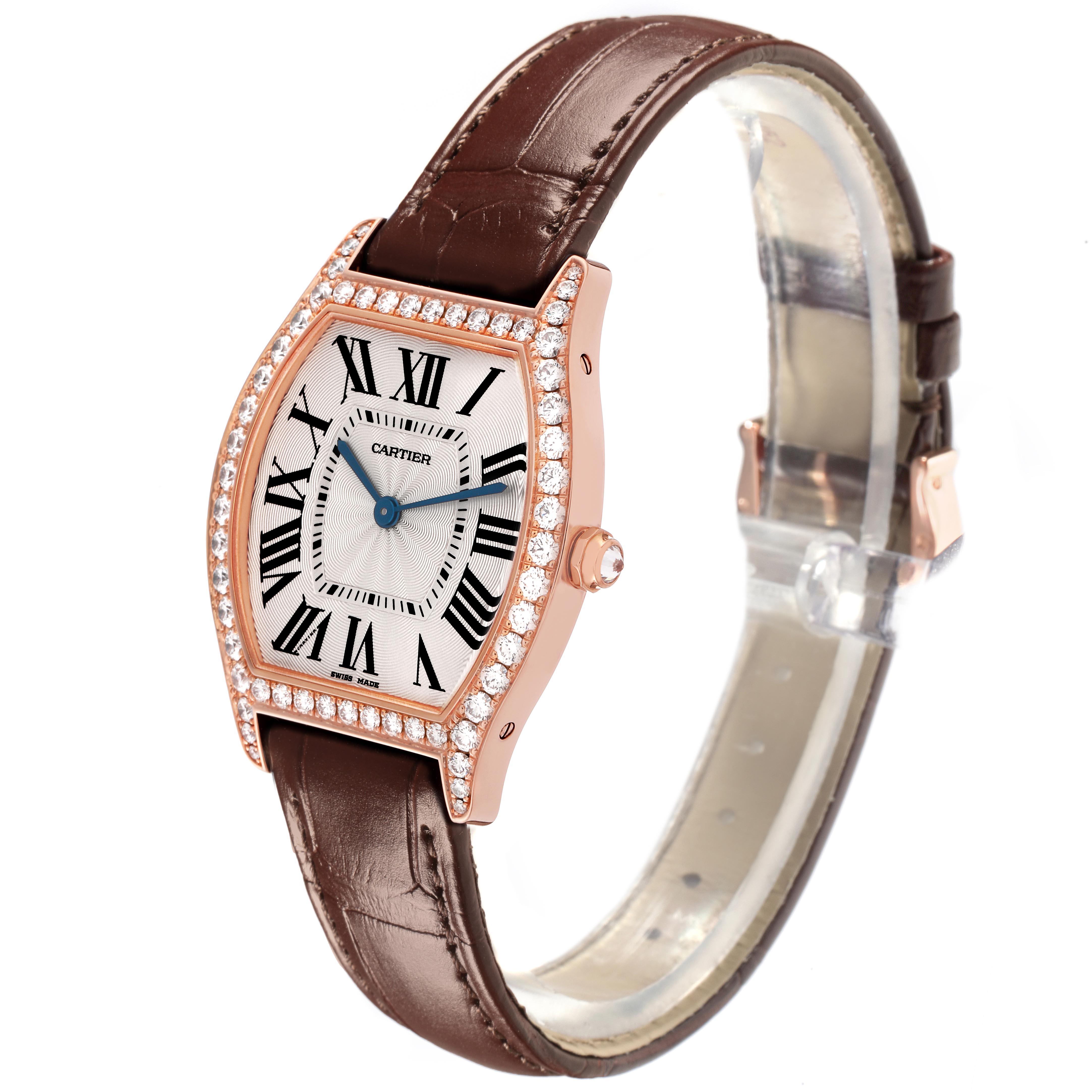 The Cartier Tortue WJTO0009 Women's Rose Gold Silver Dial WJTO0009 Women's Rose Gold Silver Dial watch is shown at a slight angle displaying the face, Roman numerals, diamond bezel, and leather strap.