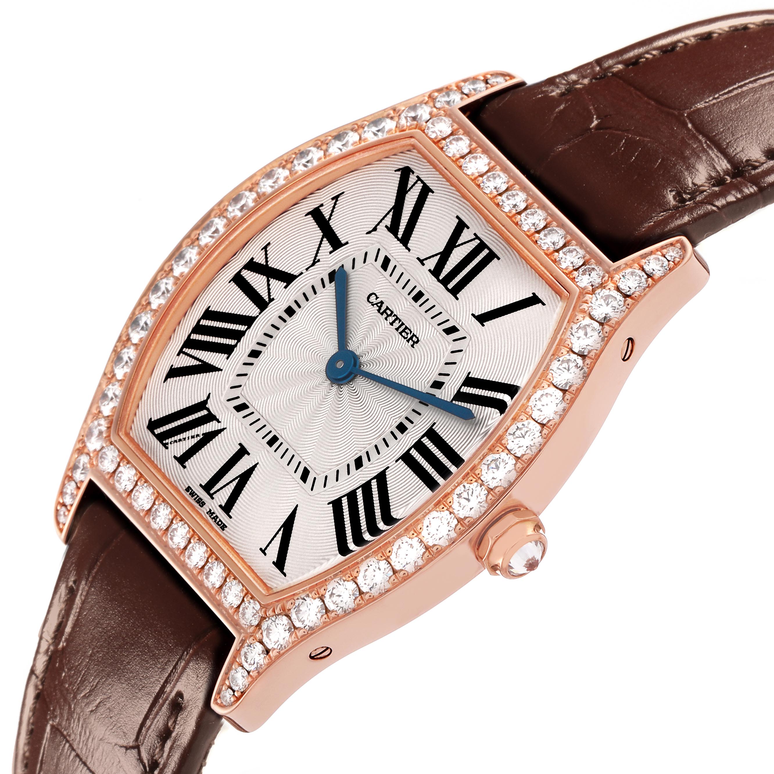 The Cartier Tortue WJTO0009 Women's Rose Gold Silver Dial WJTO0009 Women's Rose Gold Silver Dial watch is shown at an angle highlighting the diamond-studded bezel, dial, blue hands, and brown leather strap.