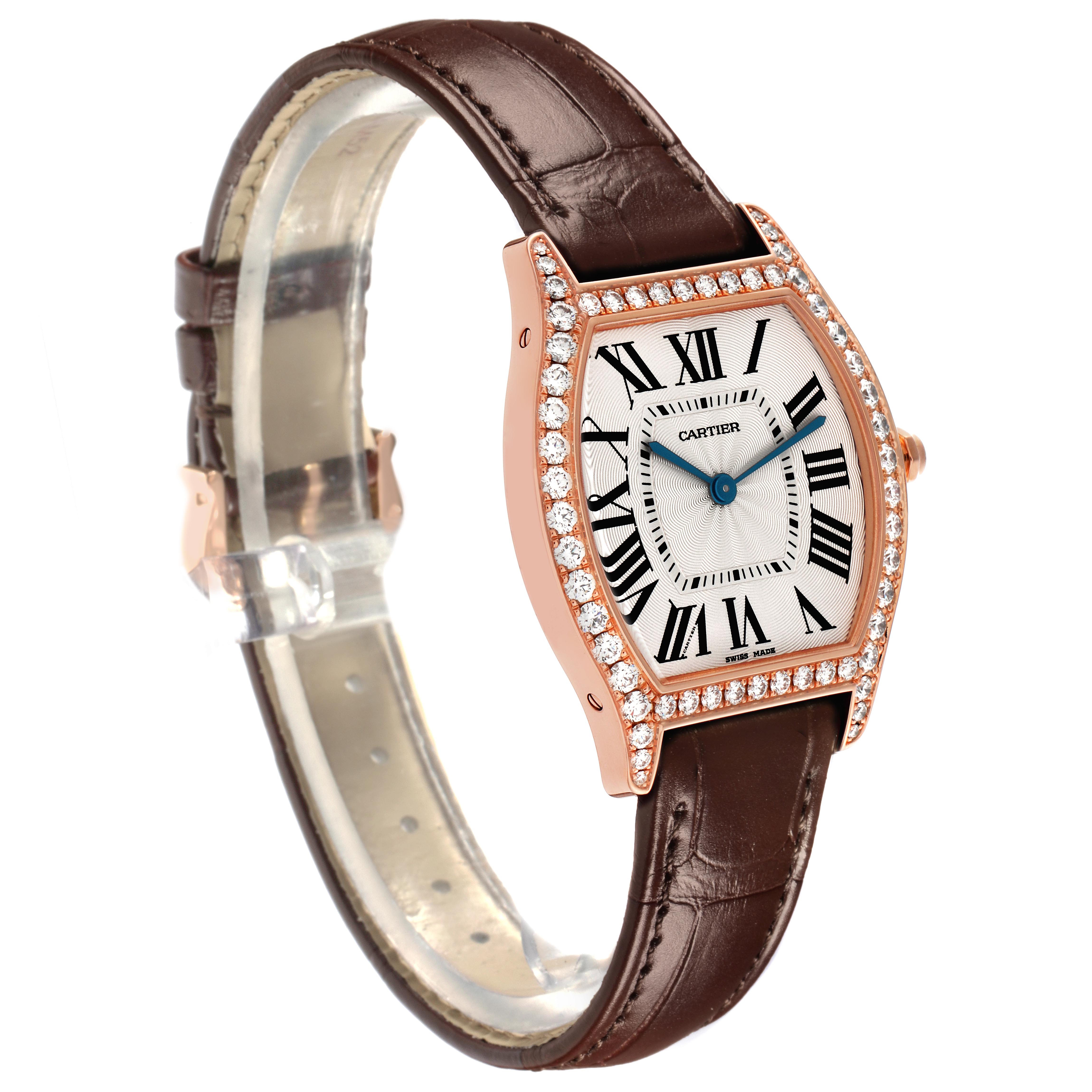 The Cartier Tortue WJTO0009 Women's Rose Gold Silver Dial WJTO0009 Women's Rose Gold Silver Dial watch is shown at a three-quarter angle, highlighting its diamond-encrusted bezel, face, and brown leather strap.