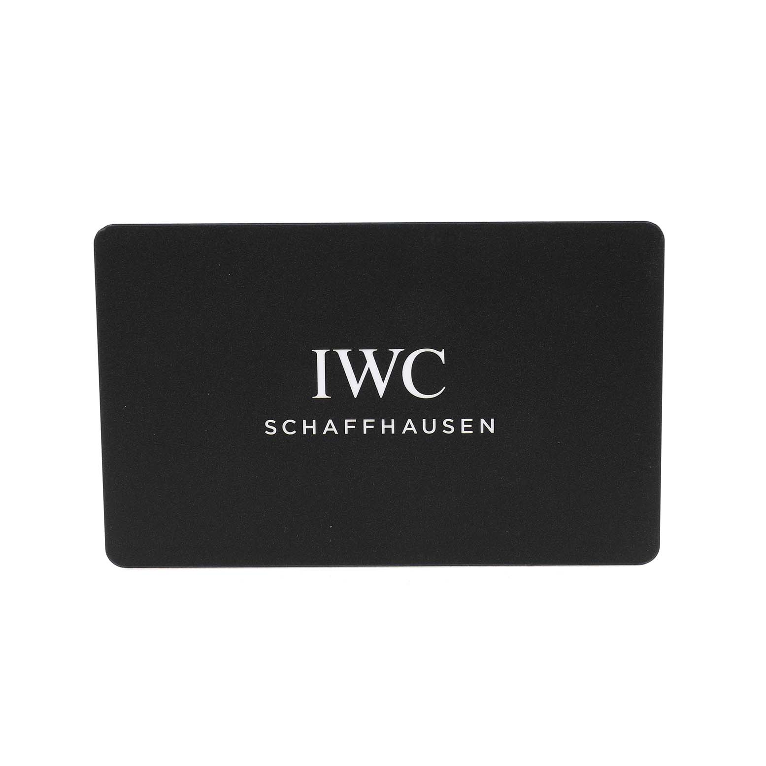 The image shows a black card with "IWC Schaffhausen" text, related to the IWC Pilot IW388103 Men's Stainless Steel Green Dial watch brand.