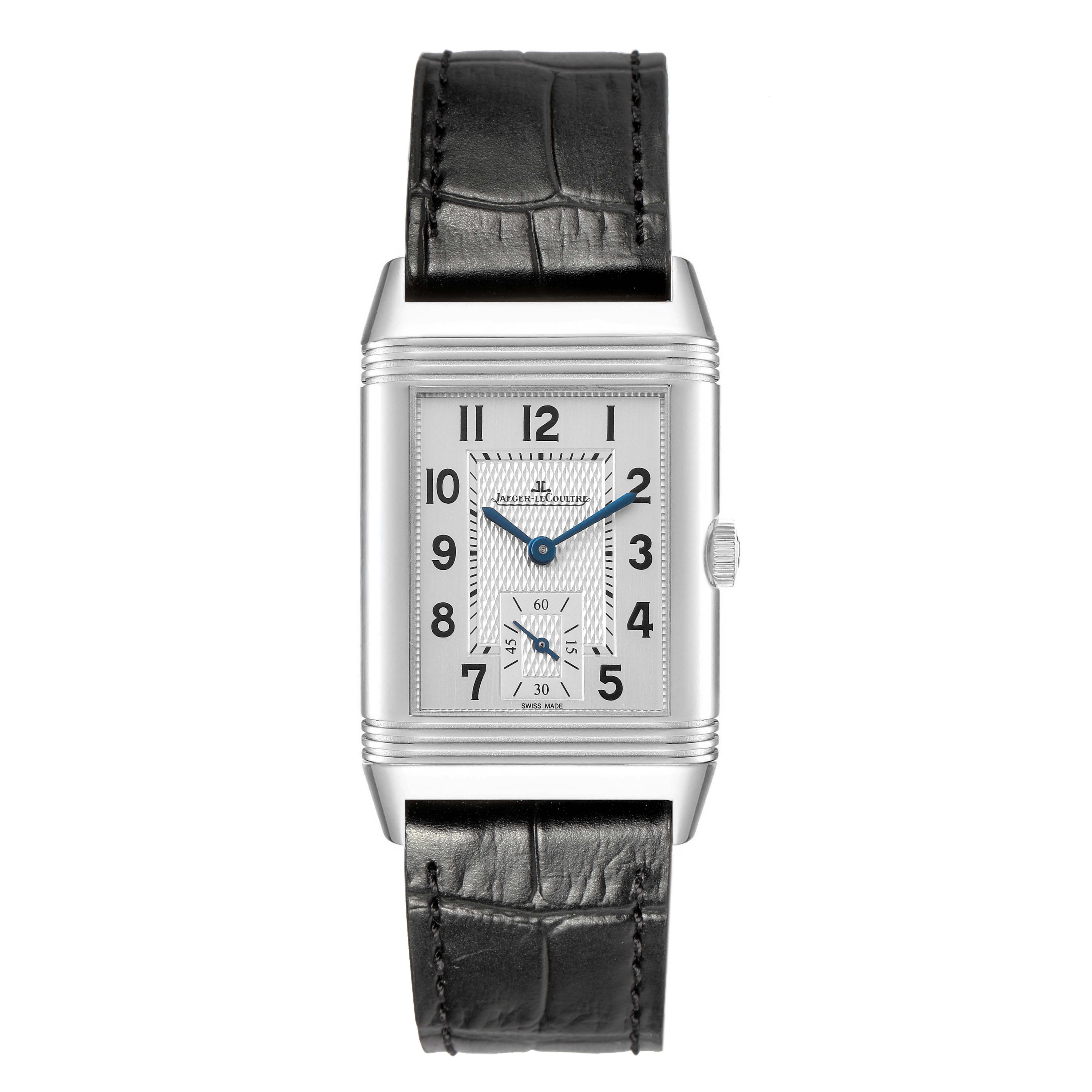The Jaeger-LeCoultre Reverso watch is shown from the front, displaying its face, rectangular case, and leather strap.
