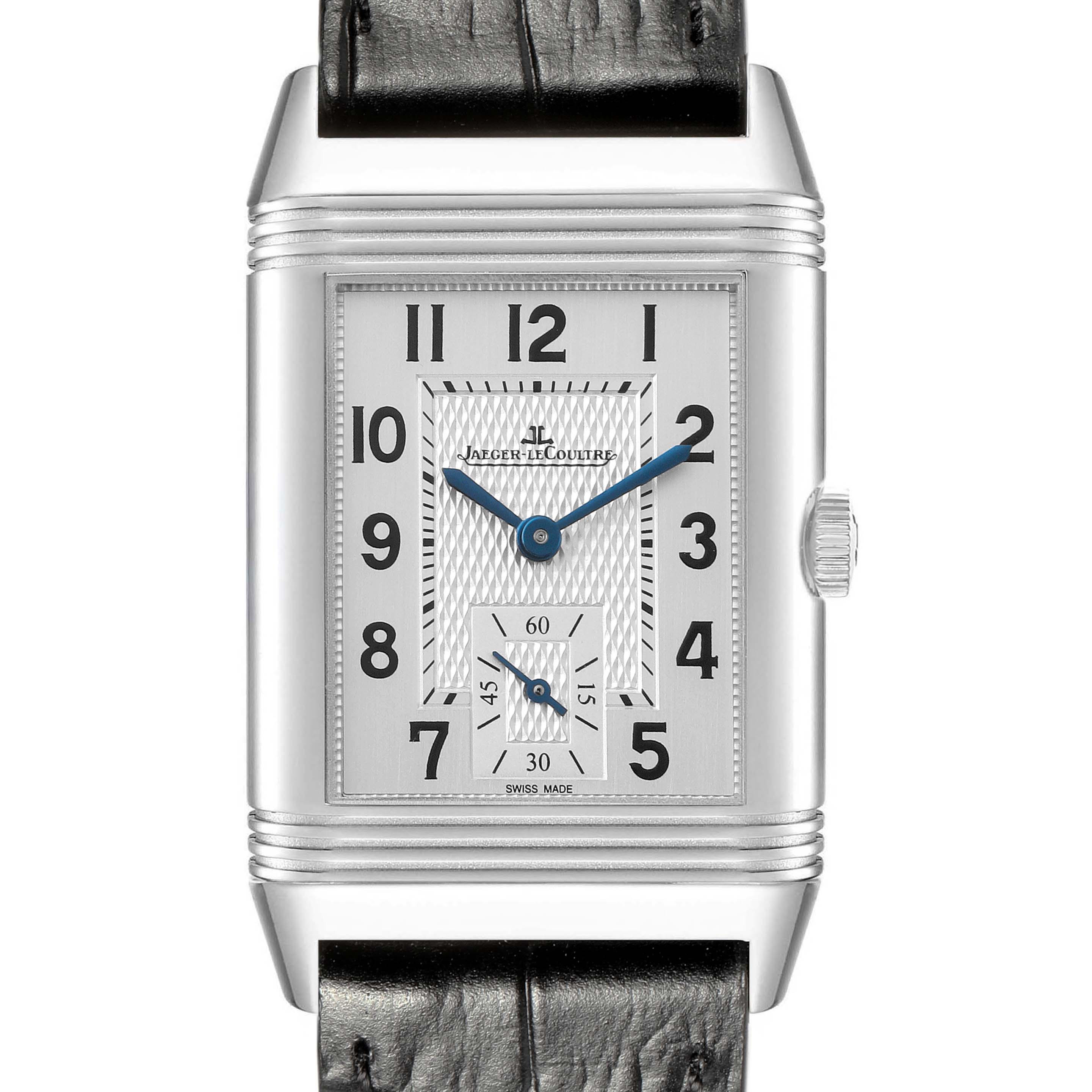 The Jaeger-LeCoultre Reverso watch is shown from the front, displaying its rectangular face, dial, and crown.