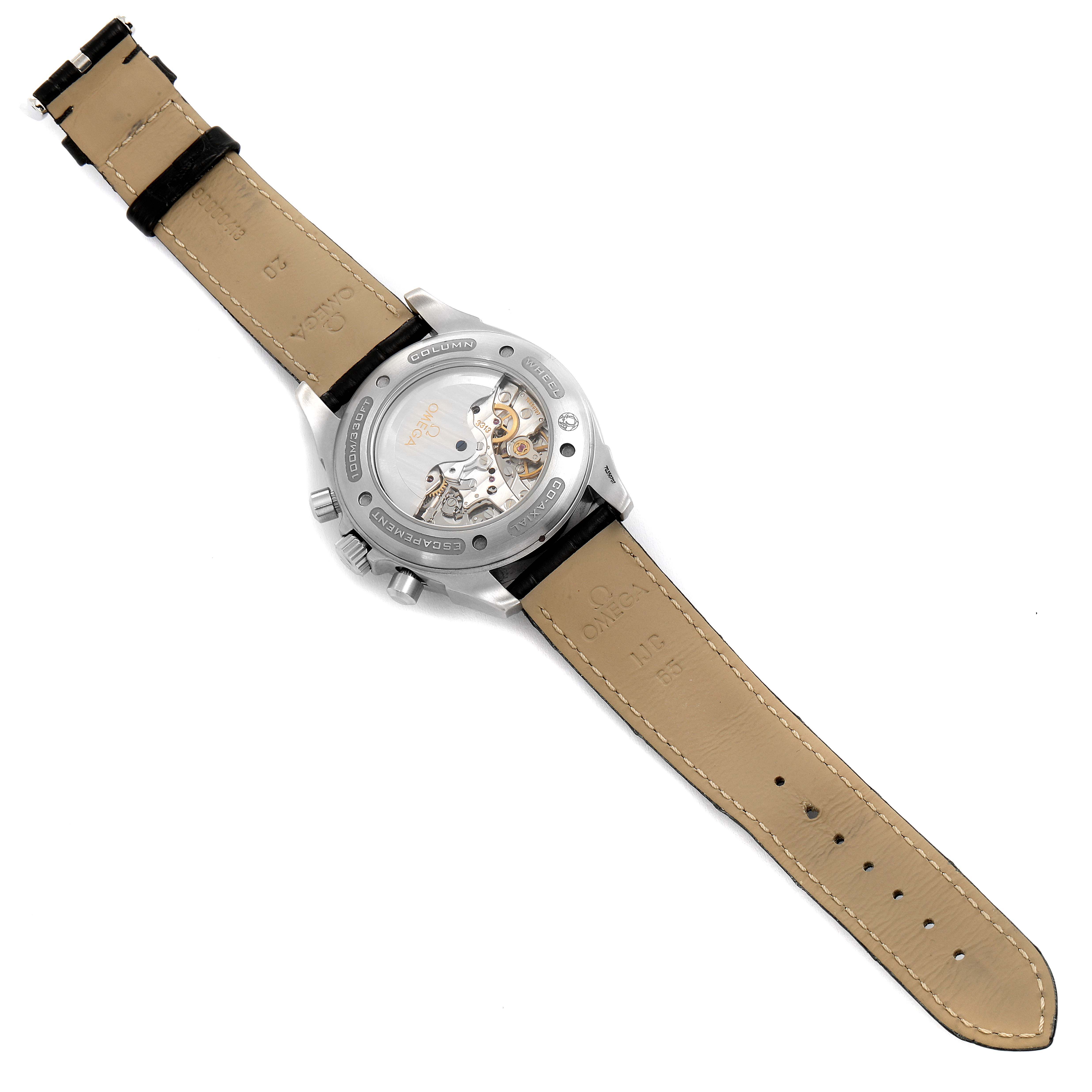 The image shows the back view of an Omega De Ville 4851.61.31 Men's Stainless Steel Red Dial 4851.61.31 Men's Stainless Steel Red Dial watch, highlighting its transparent case back, leather strap, and internal mechanisms.