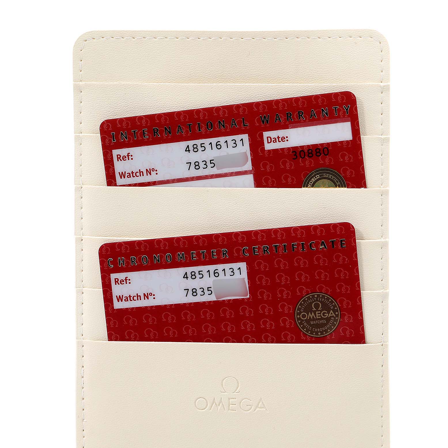 The image shows the international warranty and chronometer certificate cards for the Omega De Ville 4851.61.31 Men's Stainless Steel Red Dial 4851.61.31 Men's Stainless Steel Red Dial watch, placed in a white cardholder.