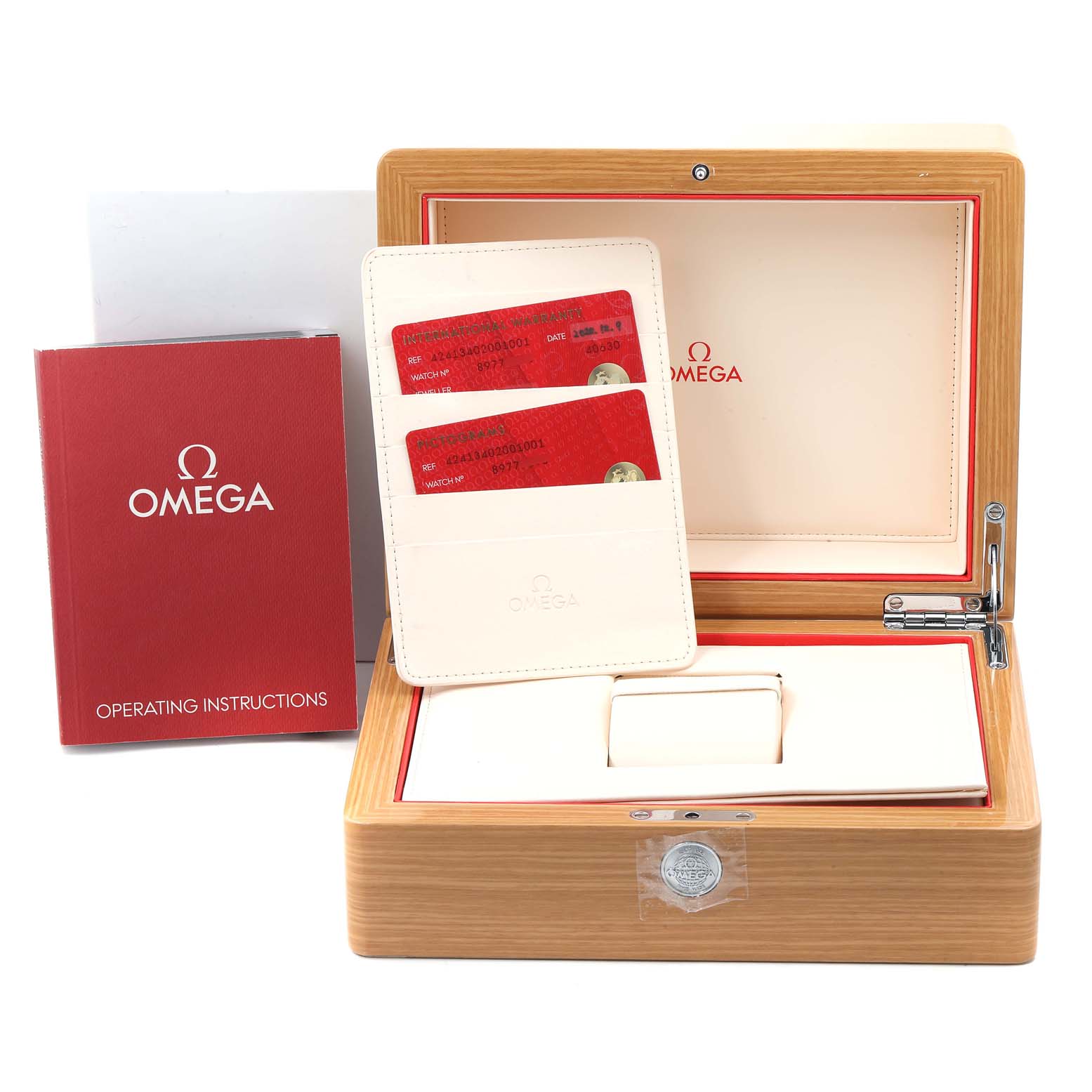 The image shows an Omega De Ville 424.13.40.20.01.001 Men's Stainless Steel Black Dial 424.13.40.20.01.001 Men's Stainless Steel Black Dial watch box, warranty cards, and operating instructions from a frontal angle.