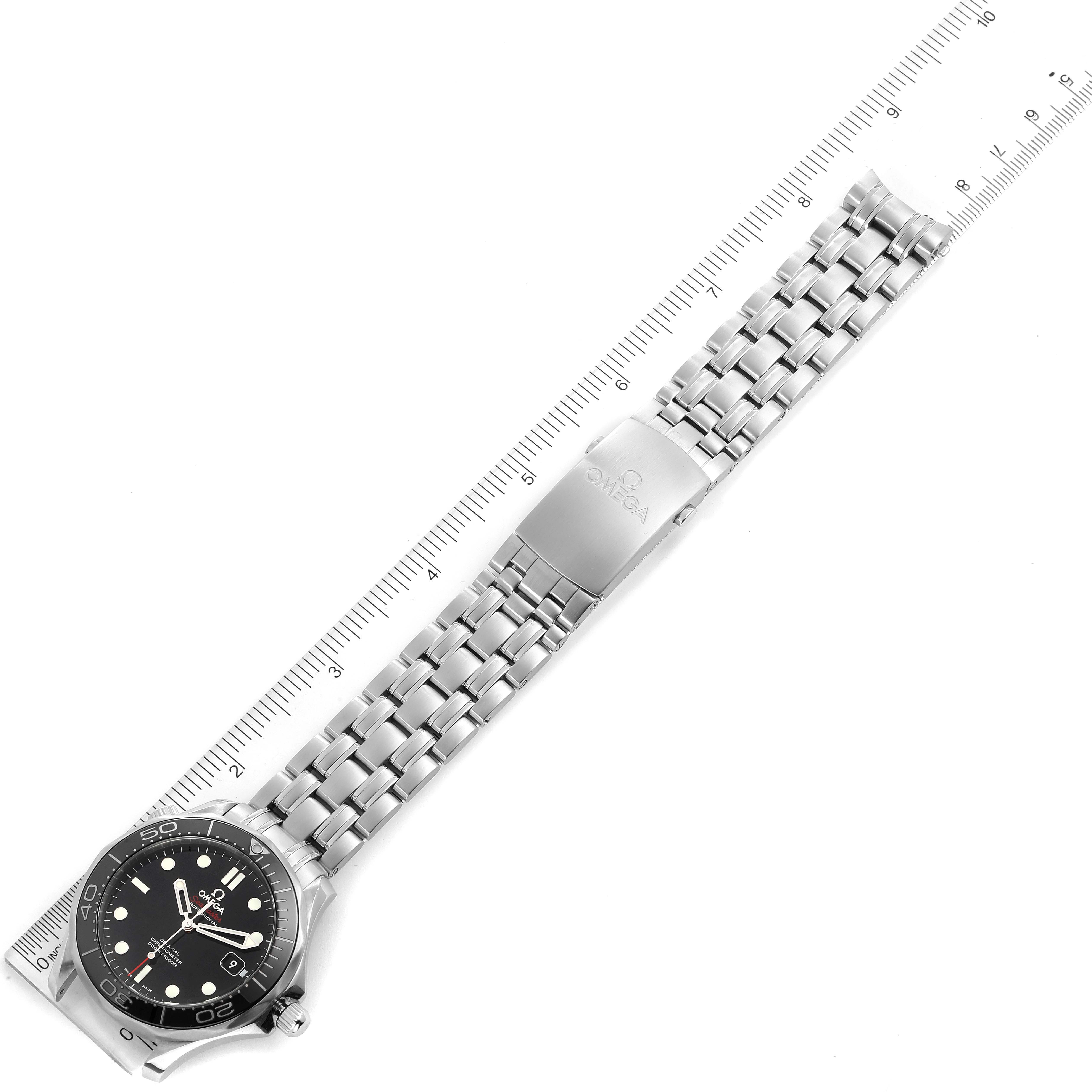 The image shows the face and bracelet of an Omega Seamaster 212.30.41.20.01.003 Men
s Stainless Steel Black Dial 212.30.41.20.01.003 Men
s Stainless Steel Black Dial watch, laying flat with a ruler for scale.