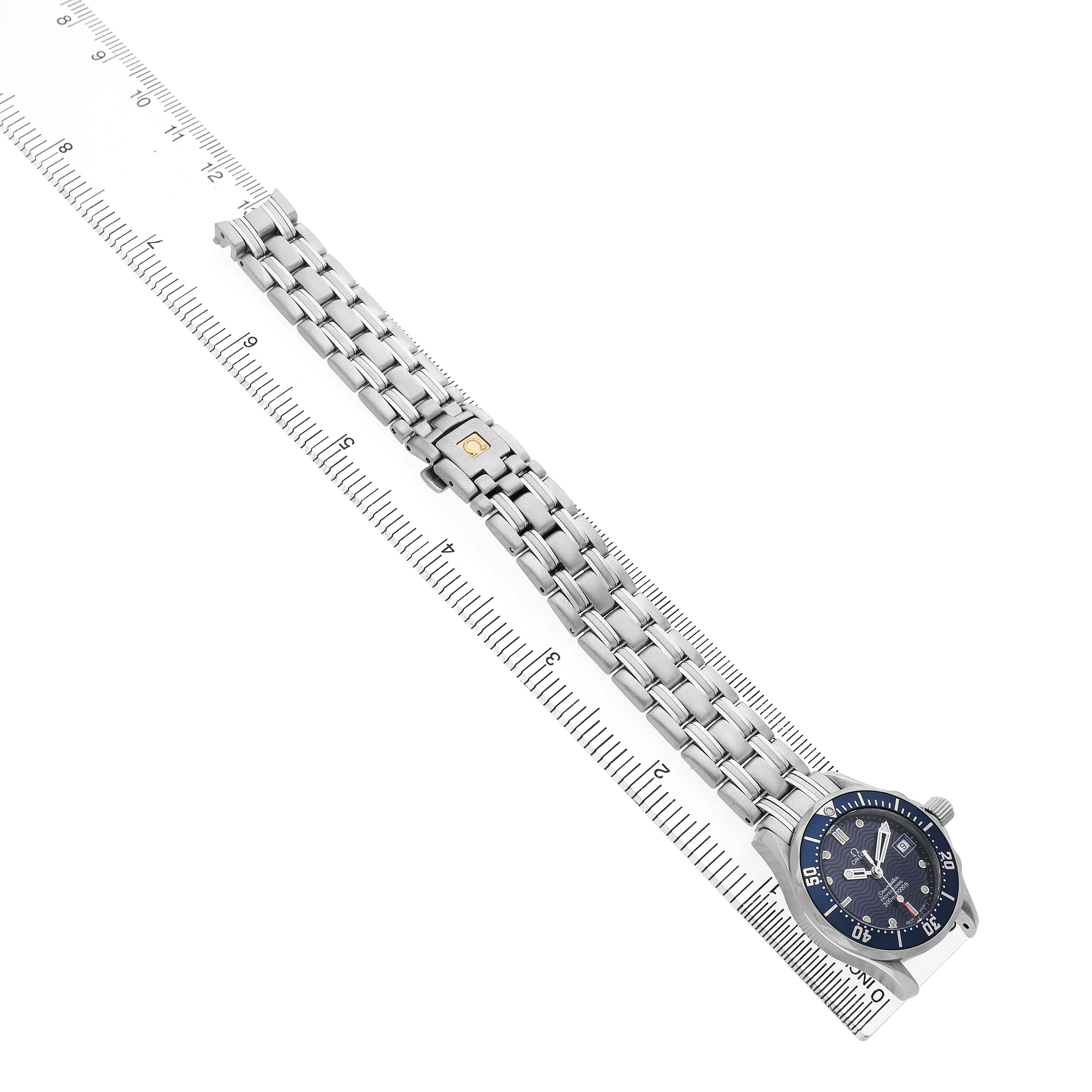 The Omega 2583.80.00 Women's Stainless Steel Blue Dial Seamaster Diver 300M Ladies Watch 2583.80.00 is shown laid flat, highlighting the blue dial, bezel, and full metal bracelet.
