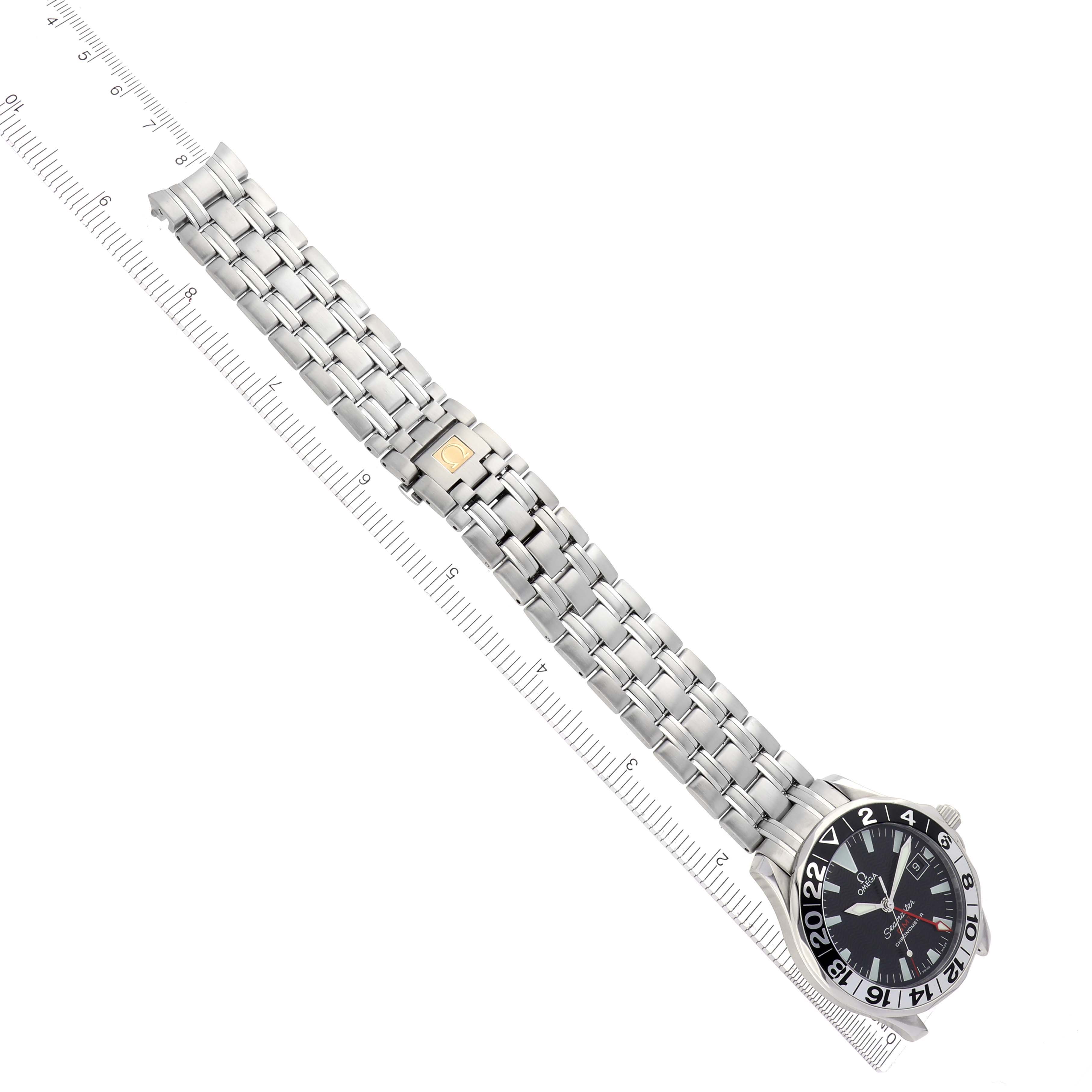 The Omega Seamaster 2534.50.00 Men's Stainless Steel Black Dial 2534.50.00 Men's Stainless Steel Black Dial watch is shown at a top-down angle, displaying its face, stainless steel bracelet, and clasp alongside a ruler for scale.