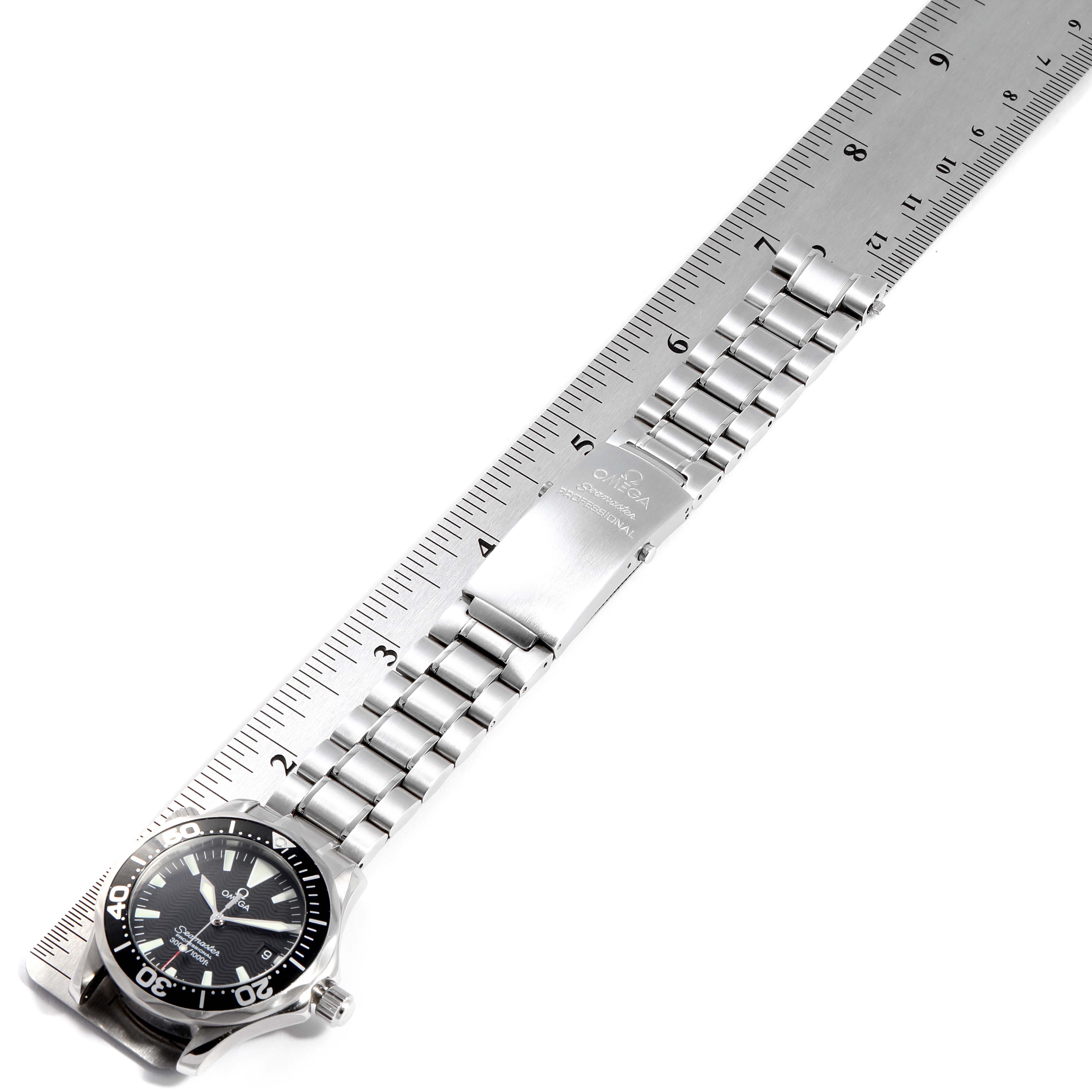 The image shows the Omega 2262.50.00  Men
s Stainless Steel Black Dial 2262.50.00  Men
s Stainless Steel Black Dial Seamaster Midsize 36 Quartz Steel Mens Watch 2262.50.00 laid flat next to a ruler, displaying the face, bracelet, and clasp.